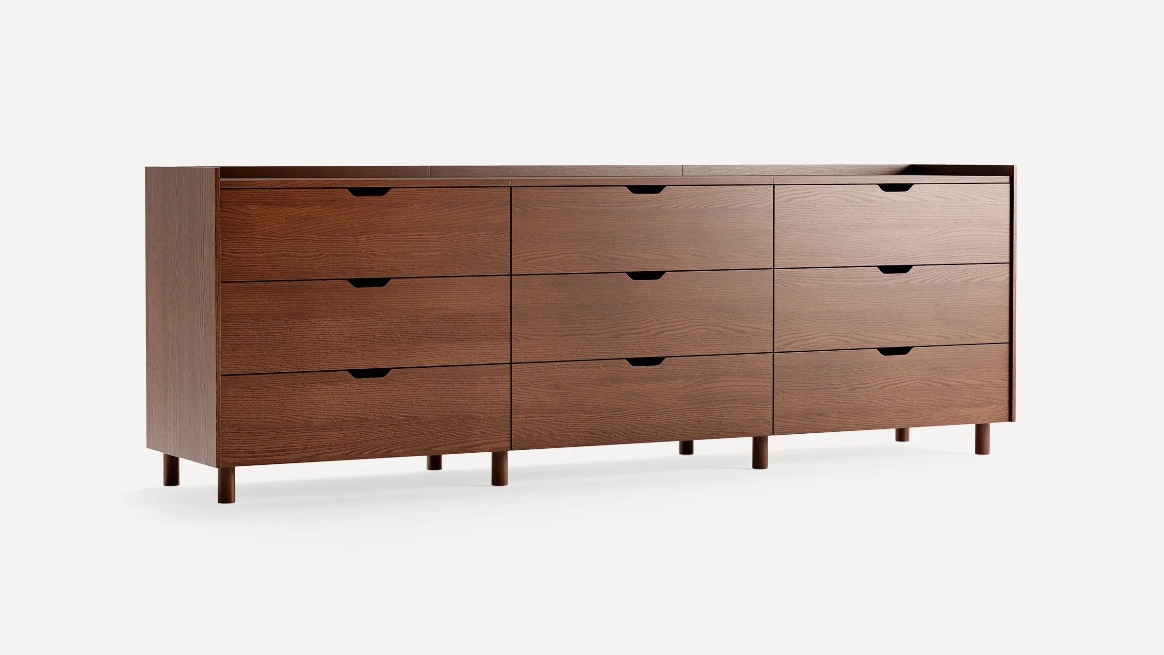 Modern wooden dresser with nine drawers, simple rectangular design, warm brown finish, and short cylindrical legs.