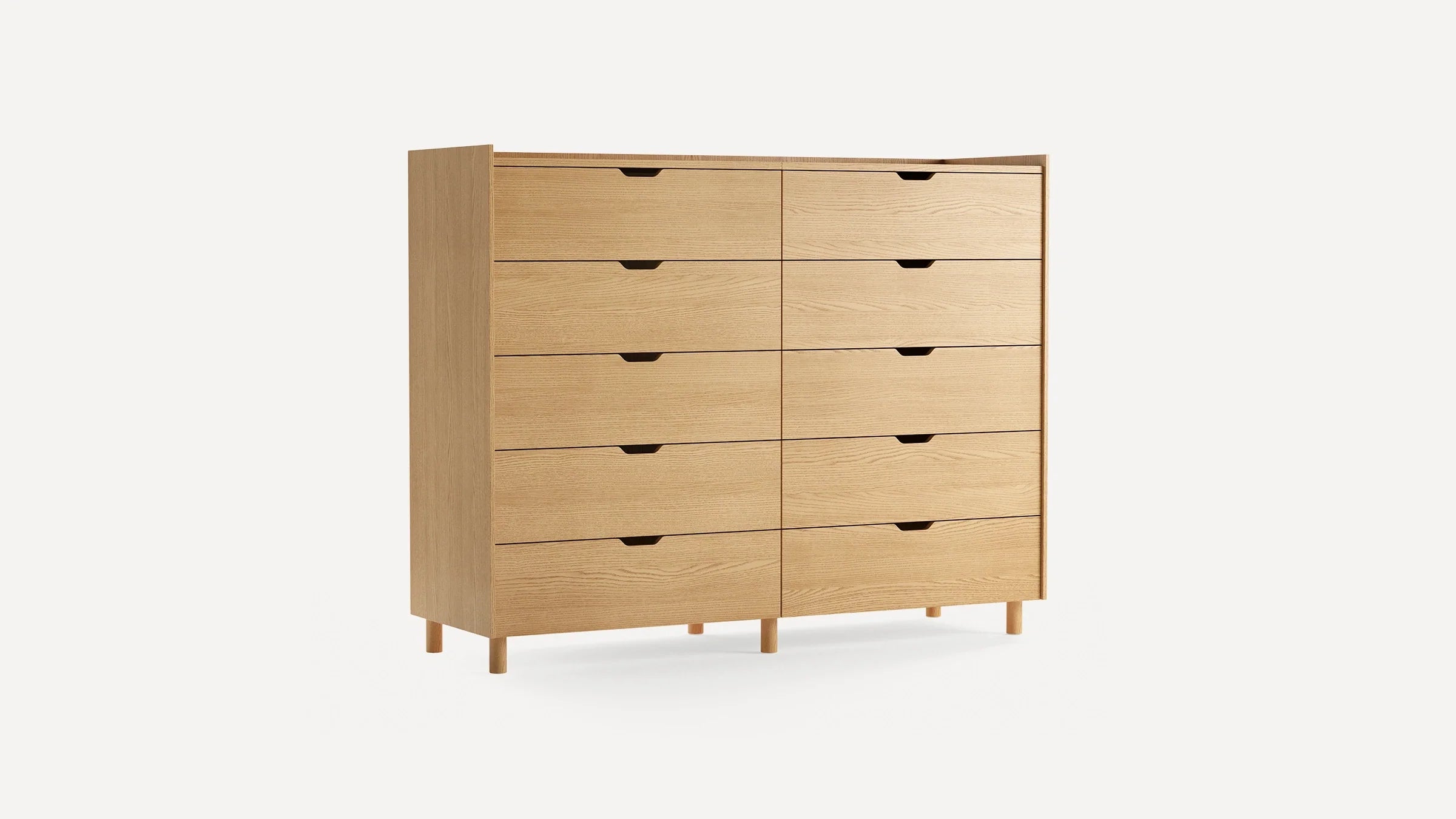 Light wood dresser with eight drawers in two columns, minimalist design, finger pull handles, and short legs, against a plain white background.