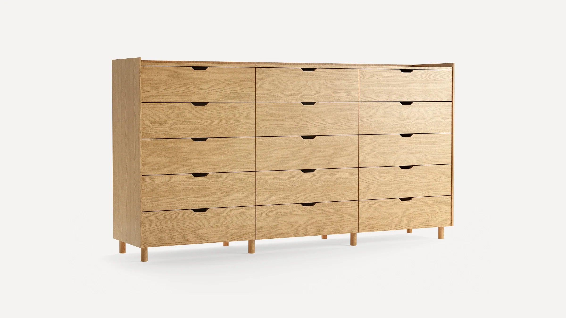 Light wood dresser with 15 drawers, minimalist design, recessed finger pulls, and slender wooden legs.