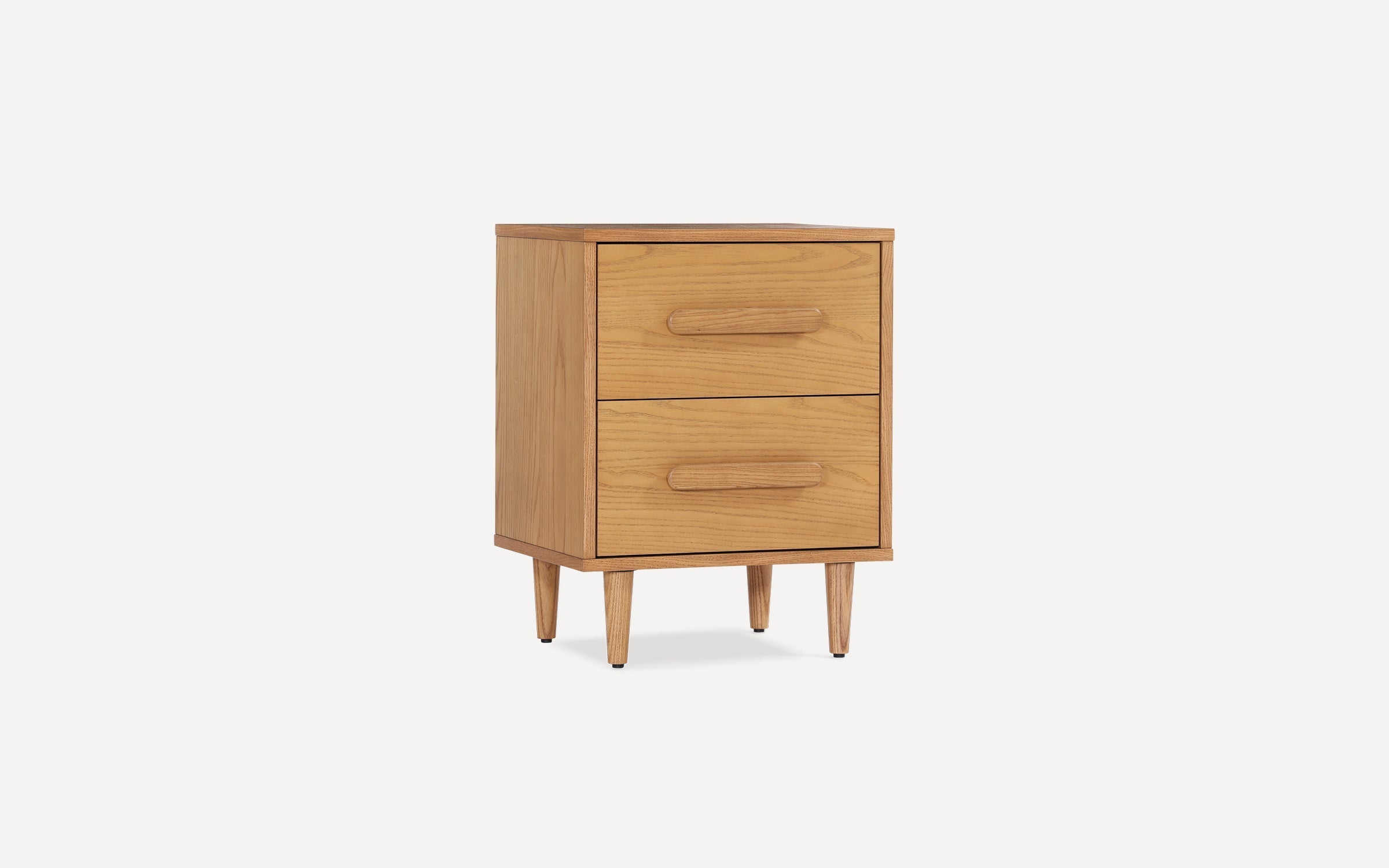 Mid-century modern two-drawer wooden nightstand with rounded handles and tapered legs in light oak finish.