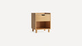 Light wood nightstand with one drawer and an open shelf at the bottom, standing on four cylindrical legs.