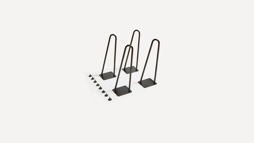 three black metal hooks on a white background