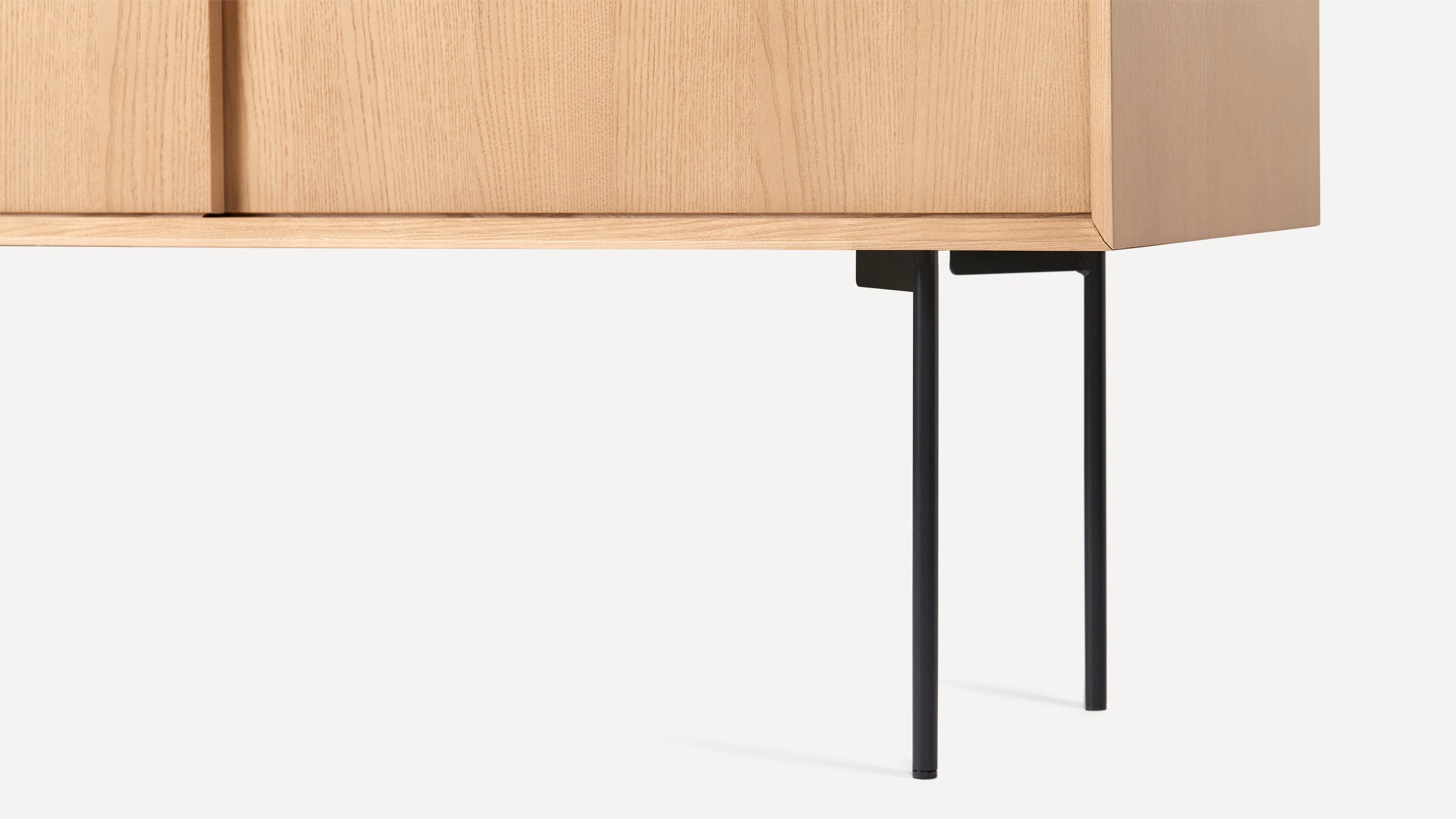 modern wooden sideboard with black metal legs and a wooden cabinet with a wooden door and two open compartments