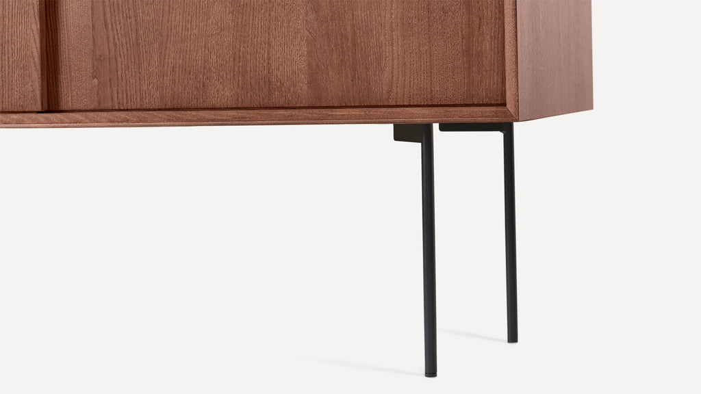 modern walnut sideboard with black metal legs and a wooden cabinet with a black metal handle on the top