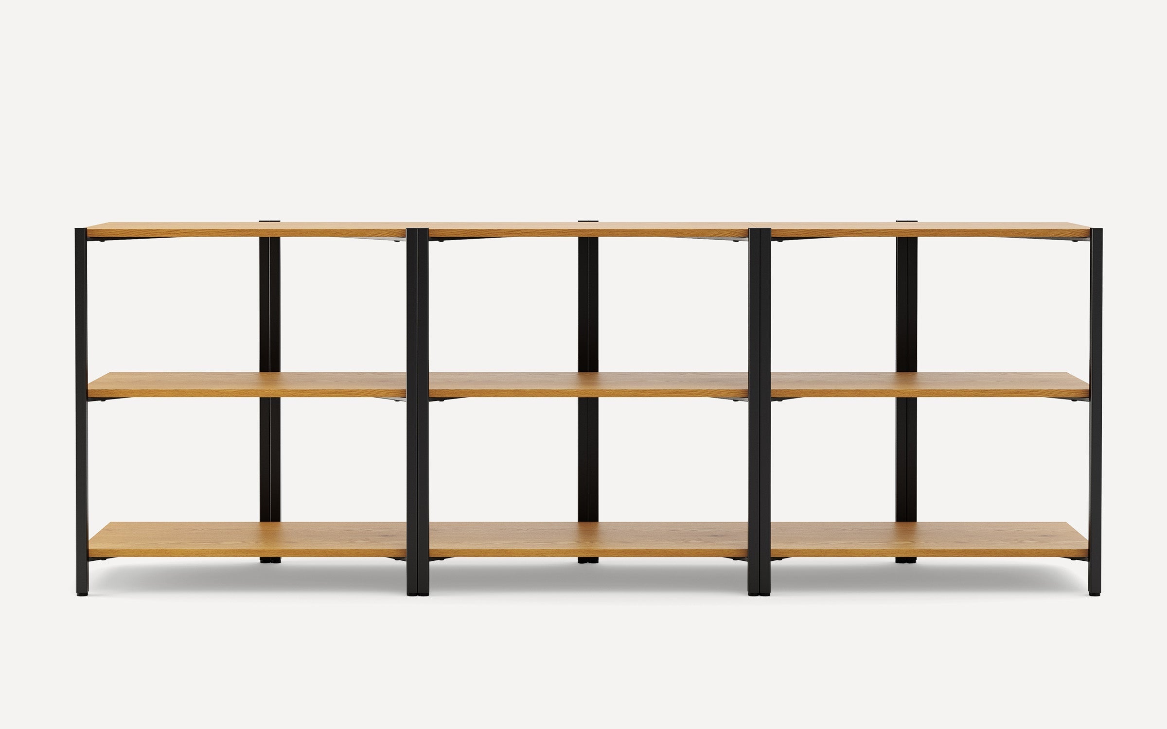 Three-section shelving unit with black metal frame and light wood shelves, modern and minimalist design.