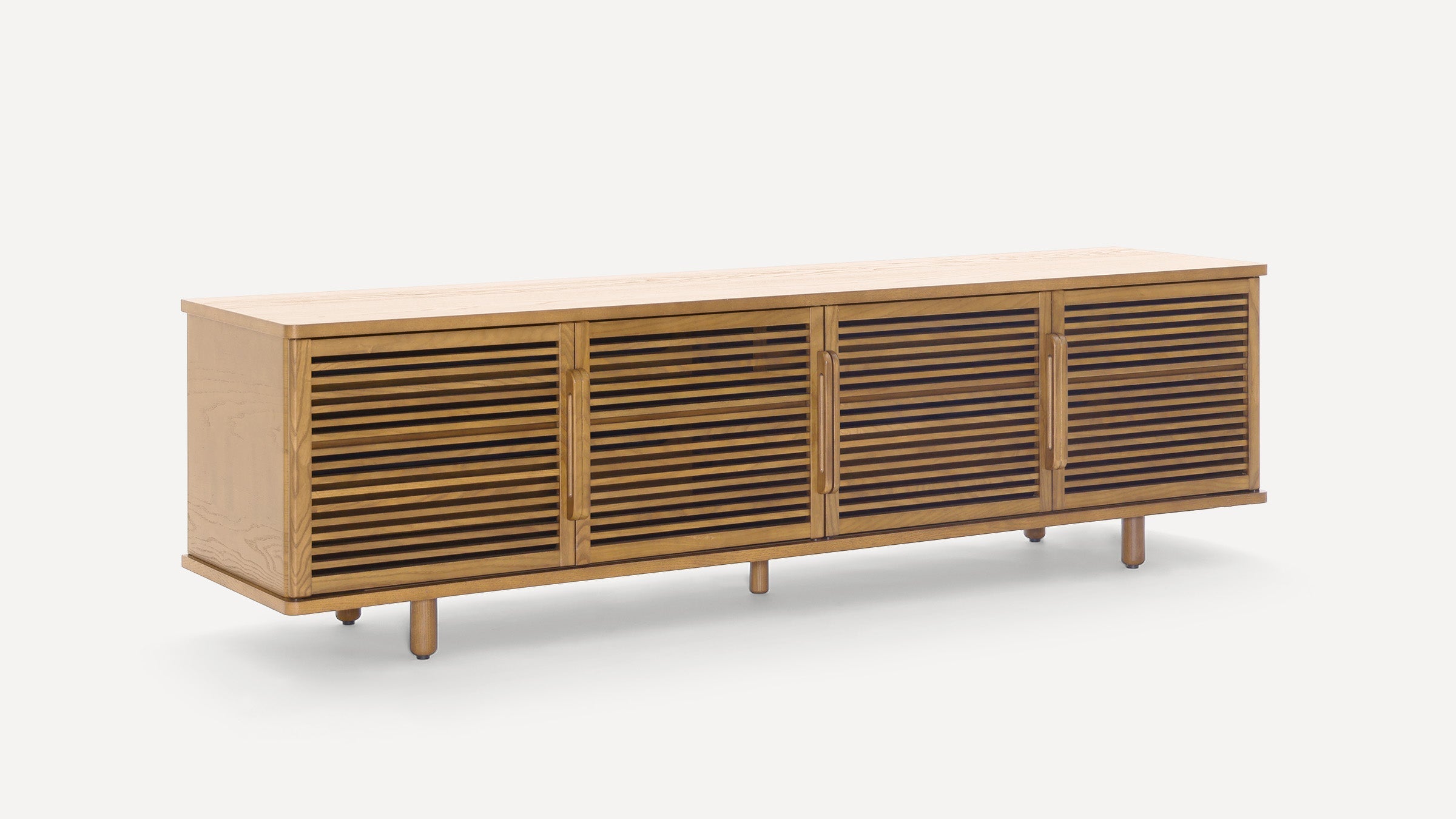 Long wooden sideboard with four slatted doors and rounded wooden handles, elevated on short cylindrical legs.