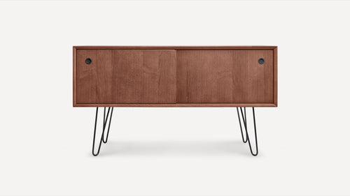 Mid-century modern wooden sideboard with sliding doors and black hairpin metal legs, showcased on plain white background.