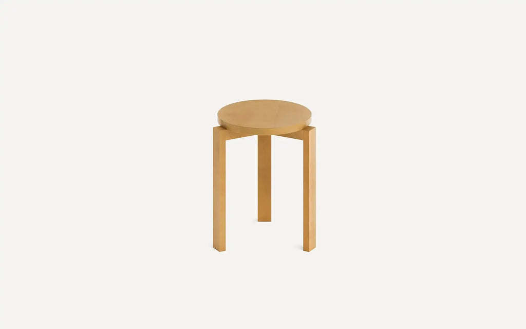 Round wooden stool with three straight legs and a light natural wood finish, set against a plain white background.