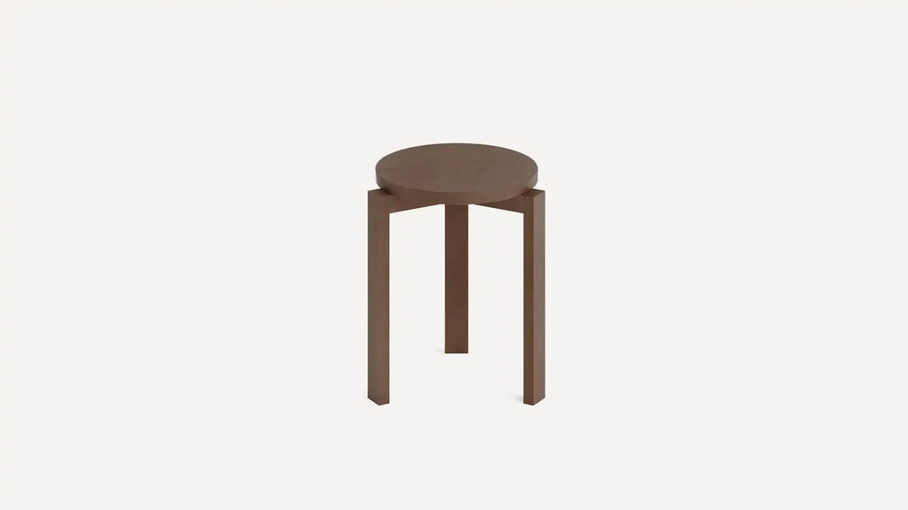 Round wooden stool with three straight legs in a minimalist design against a plain white background.