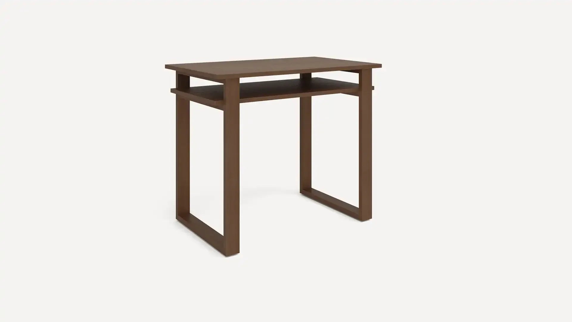 Compact wooden desk with a simple rectangular design and an open shelf underneath the tabletop, stained in a medium brown finish.
