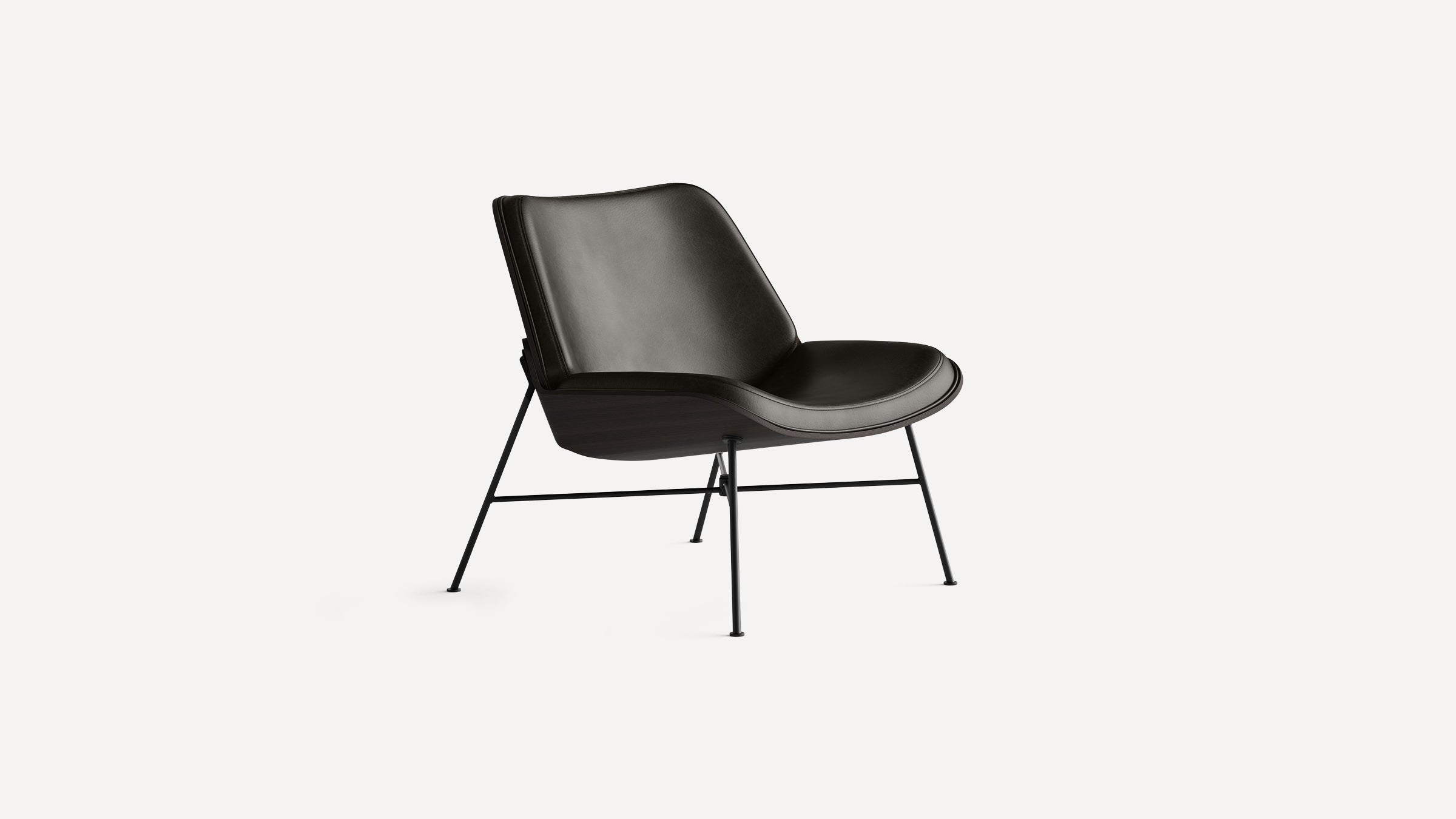 Modern black leather lounge chair with curved seat and backrest, mounted on slender black metal legs.