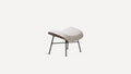 Modern ottoman with curved white cushioned top, wooden base edge, and black metal legs on a white background.