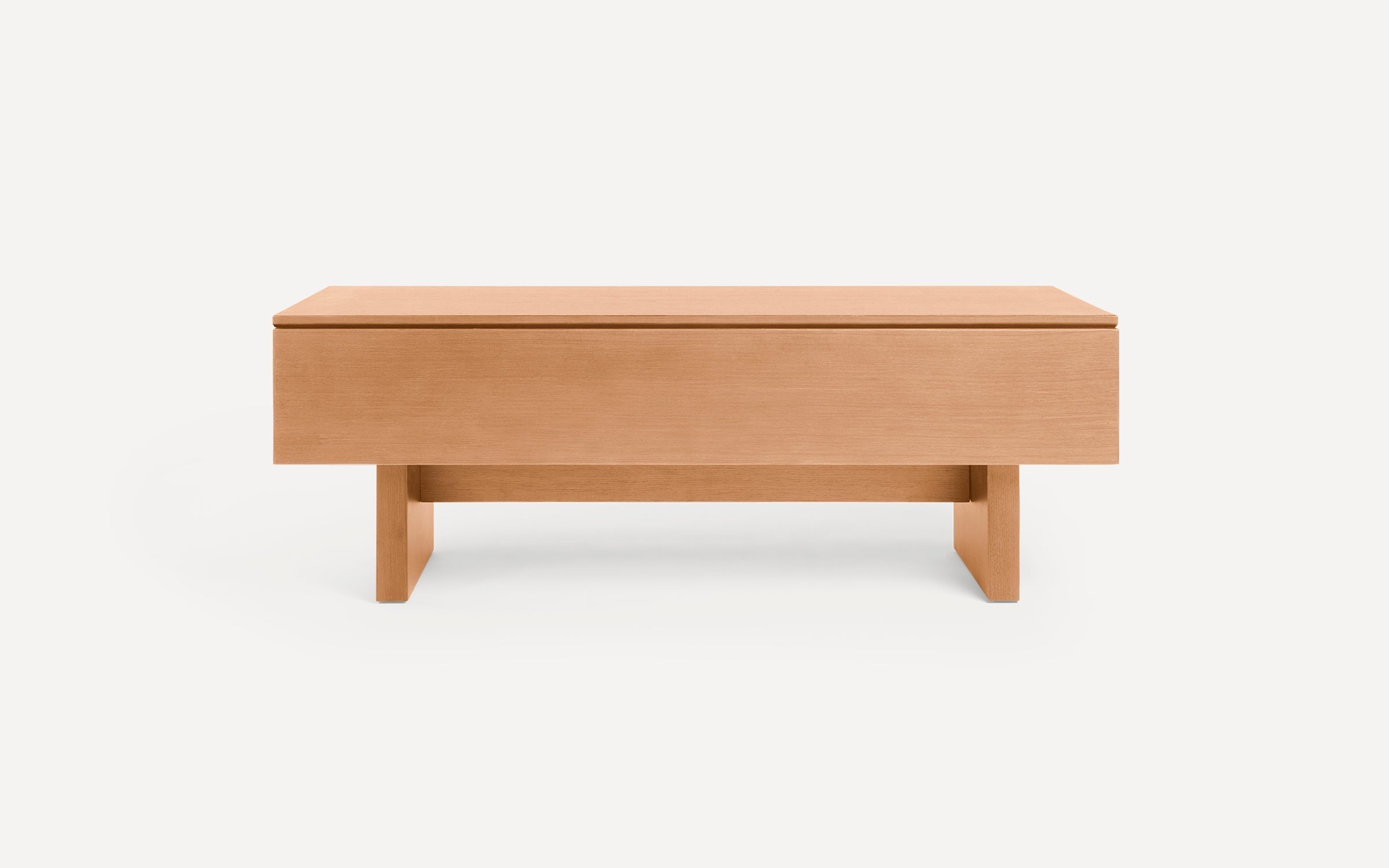 Rectangular wooden coffee table with clean lines and a minimalist design, featuring a flat top and sturdy legs.