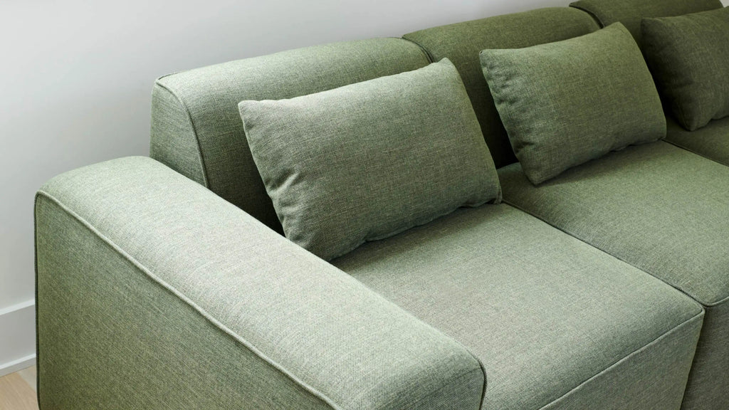 modern green fabric sectional sofa with clean lines and clean lines on the back, and matching with the matching cushions