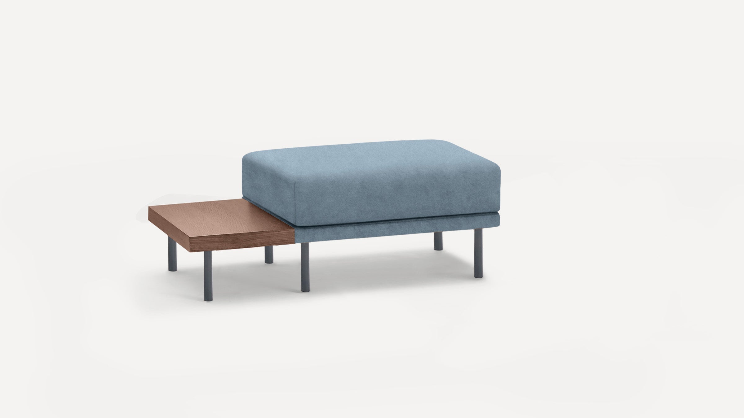 Modern ottoman with light blue cushioned top and attached wooden side table, supported by slim dark legs.