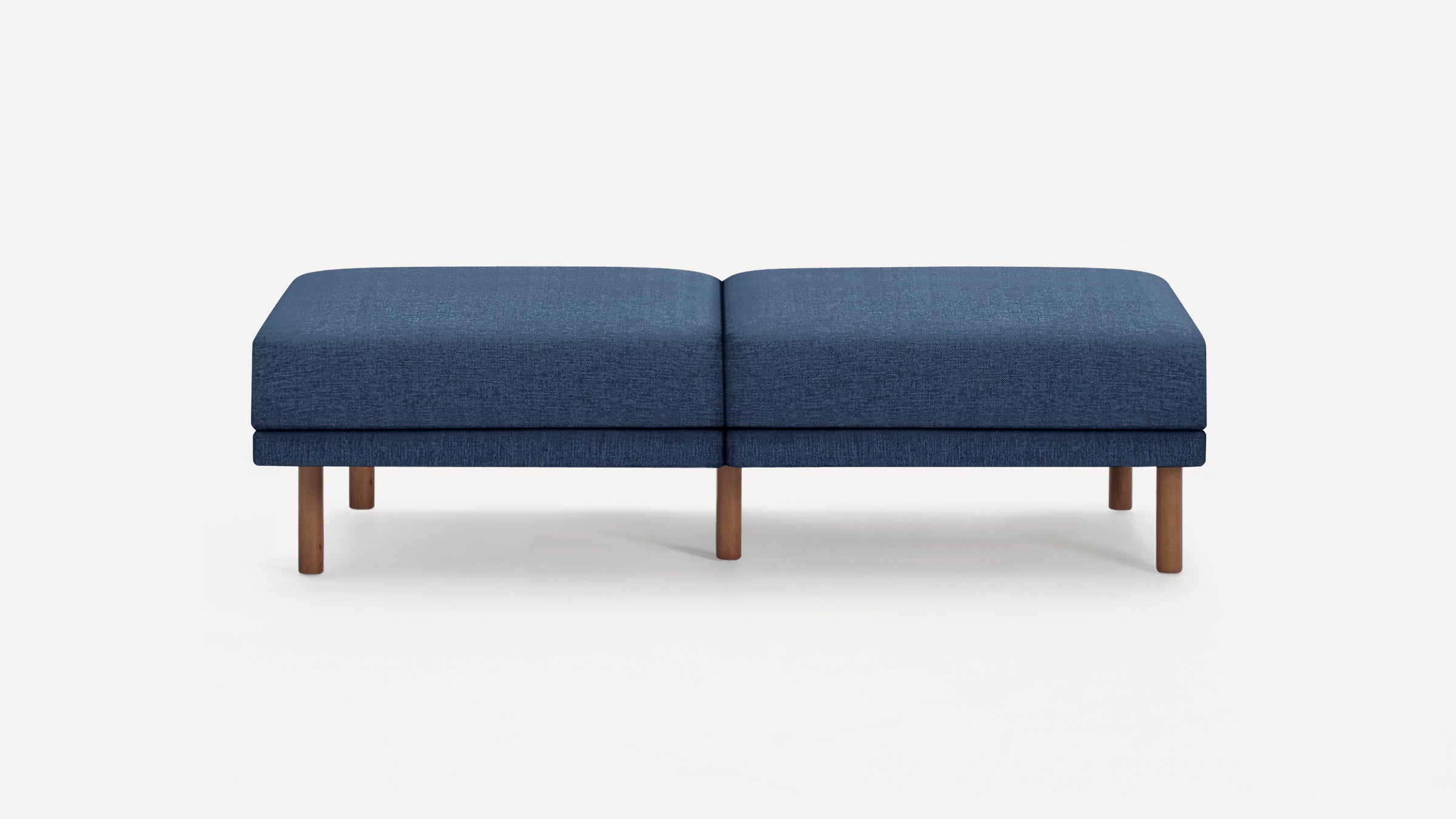 A modern, rectangular, navy blue upholstered bench with five wooden legs on a light background.