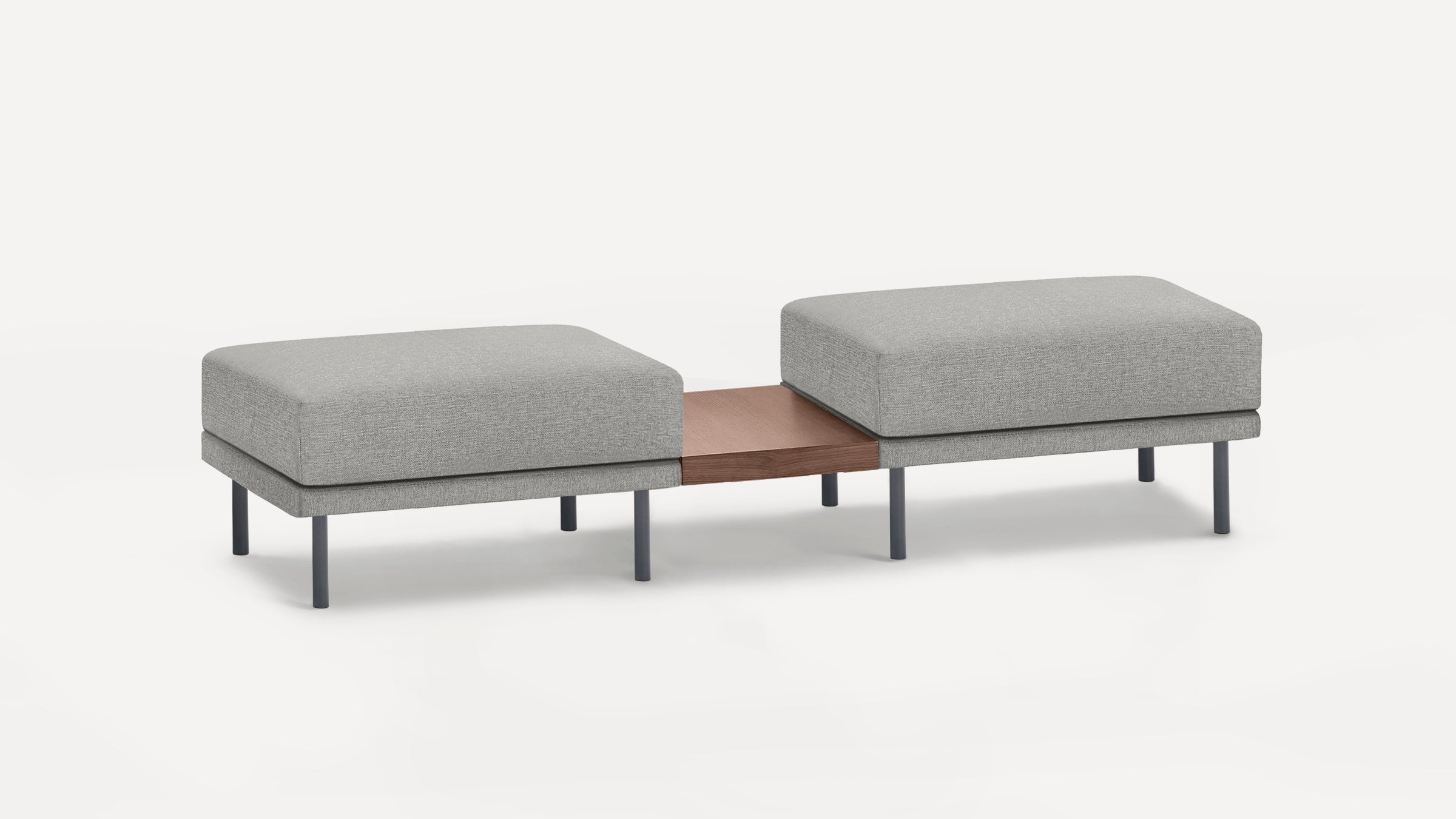 Modern gray fabric bench with two cushioned seats separated by a wooden central platform, supported by black metal legs.