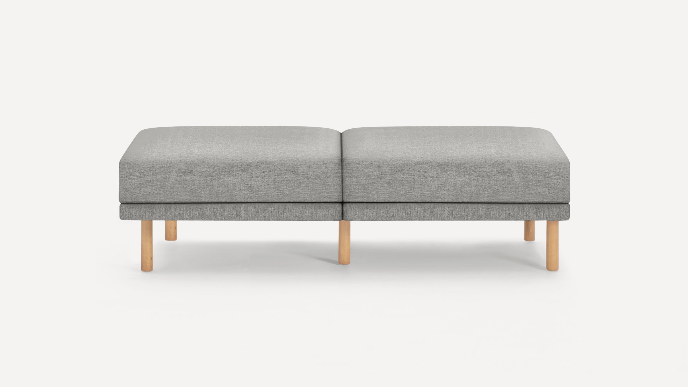 Minimalist rectangular gray upholstered bench with light wooden legs, designed for modern interiors.