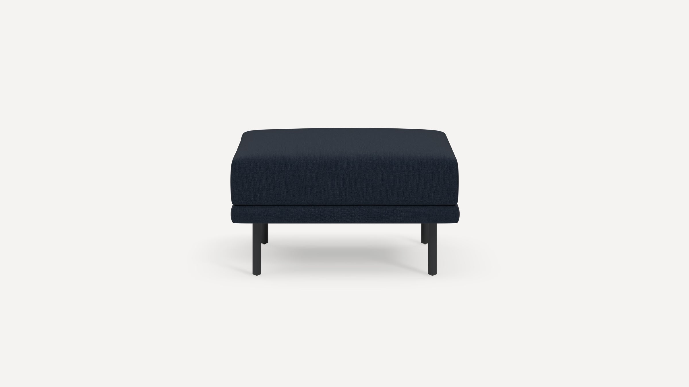 A modern navy blue upholstered ottoman with black metal legs, shown from the front against a white background.