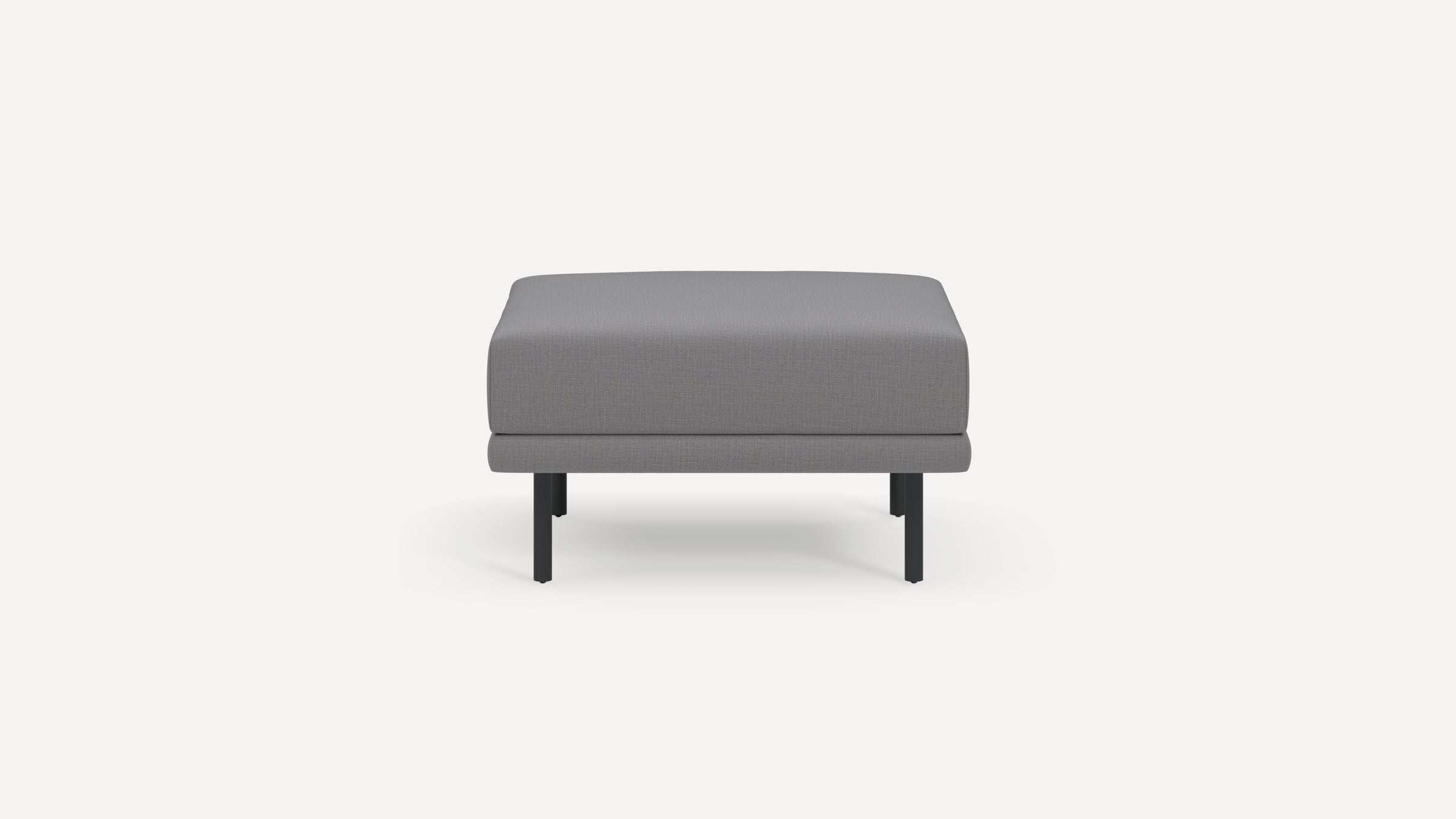 Square gray upholstered ottoman with slender black metal legs, displayed against a plain white background.