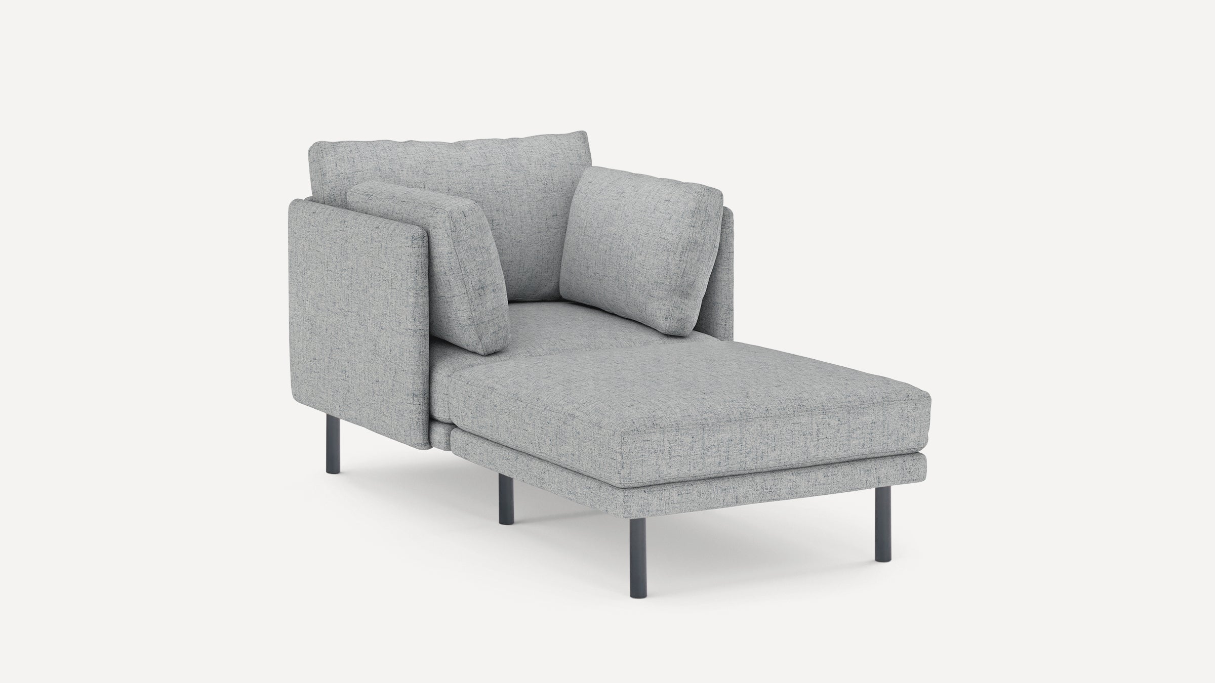 Light grey upholstered modern chaise lounge with three cushions and black metal legs on a white background.