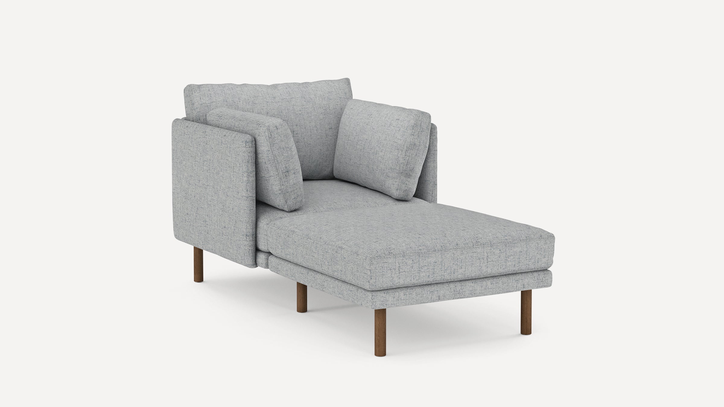 Light gray upholstered chaise lounge with wooden legs and two large cushions against a plain white background.