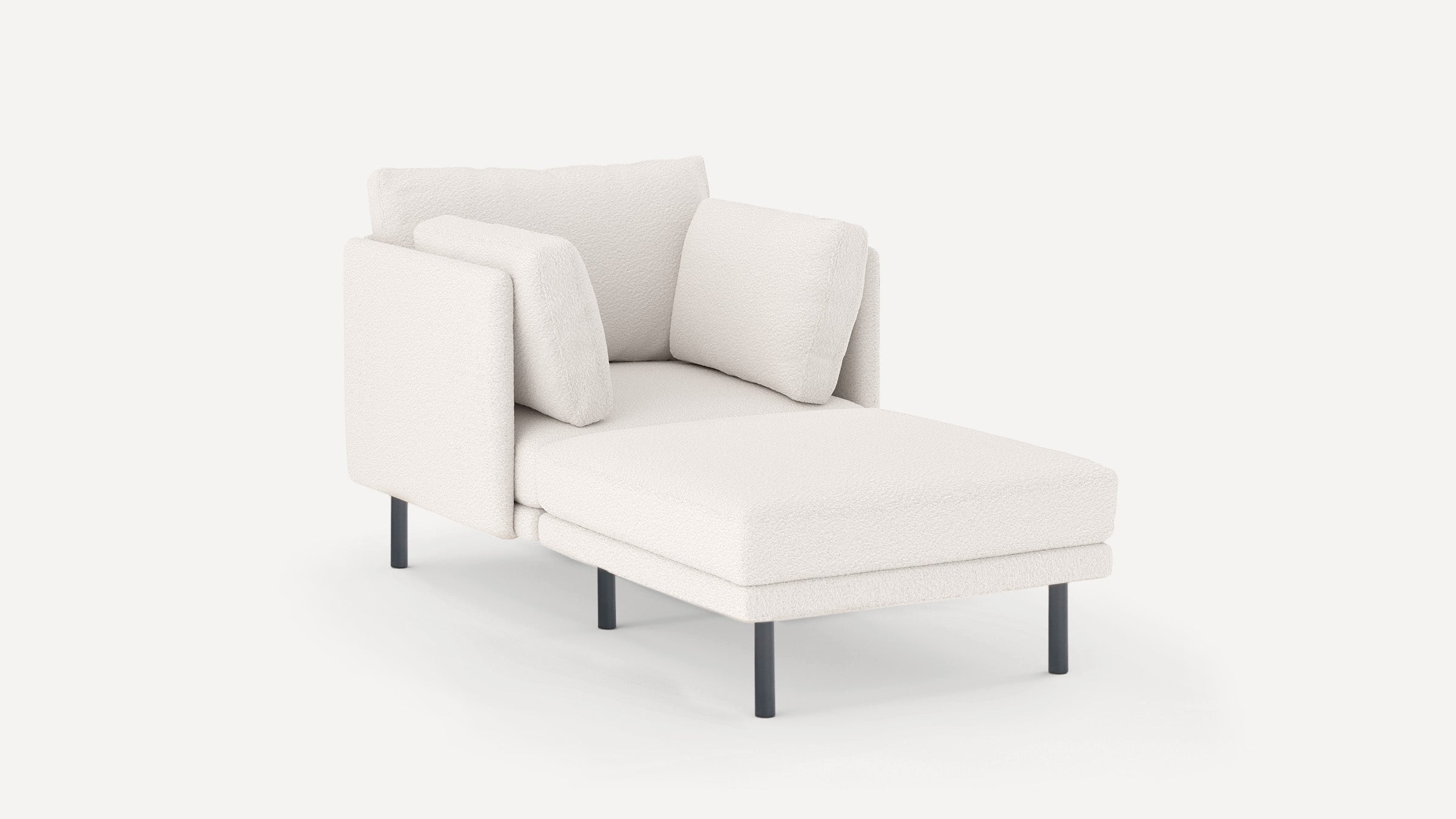 Modern white upholstered chaise lounge with sleek black legs, high armrests, and two matching cushions.