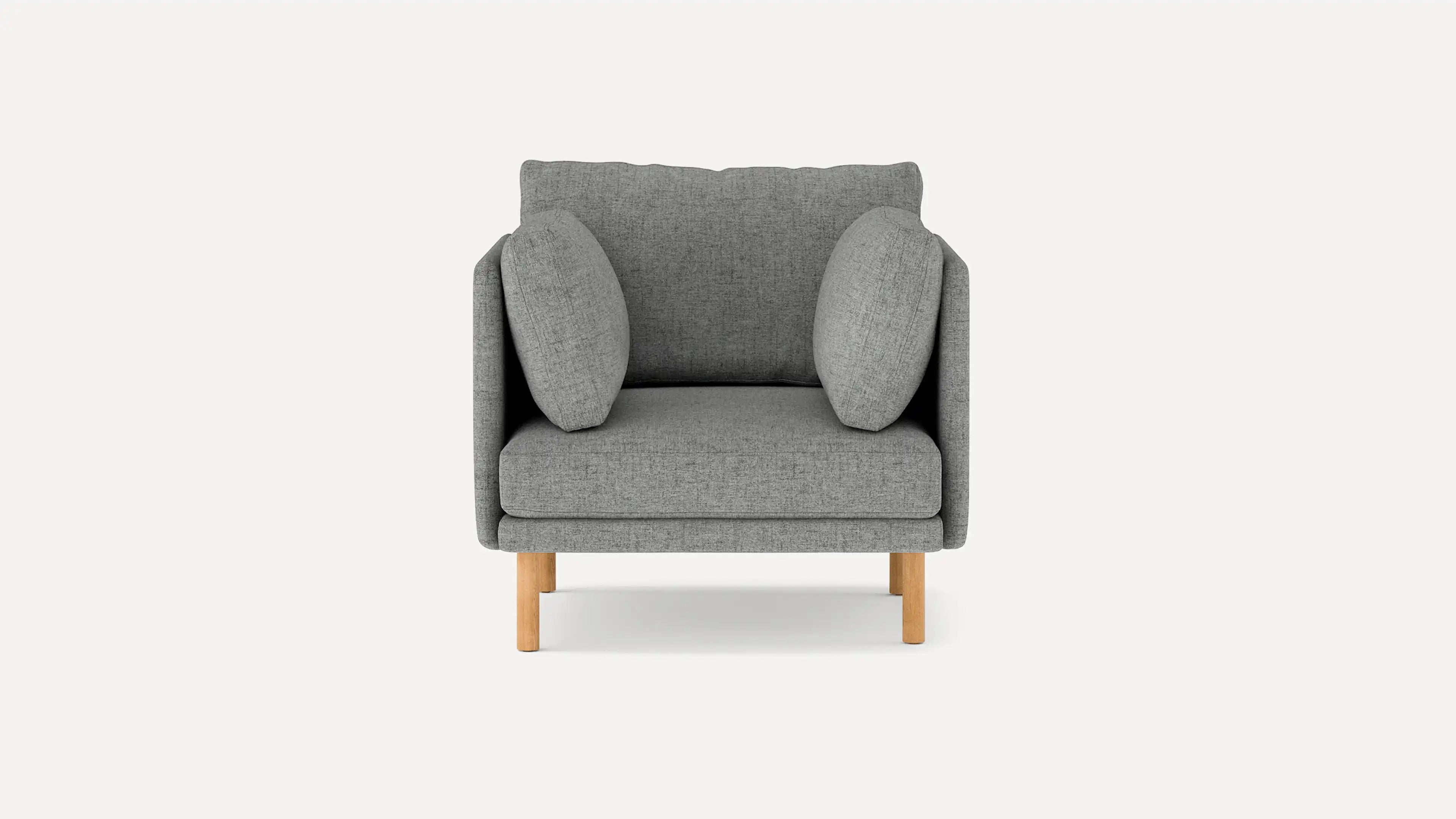 Modern gray fabric armchair with two matching side cushions and light wooden legs, shown against a plain white background.
