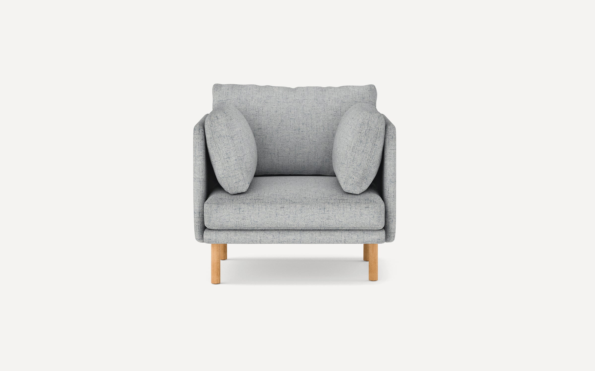 Front view of a modern gray fabric armchair with cushioned back and sides, supported by four wooden legs.