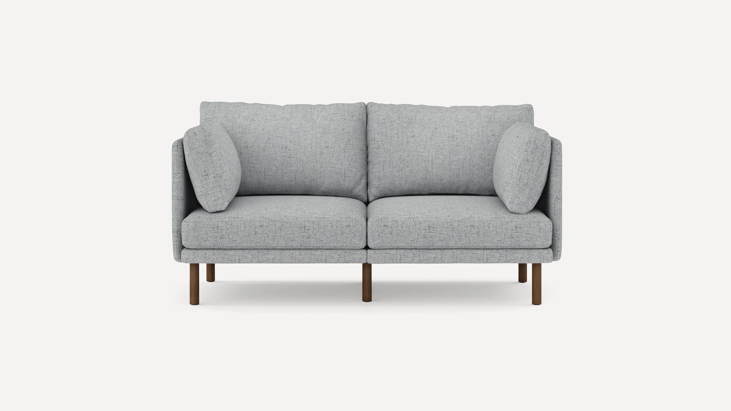 Modern light gray fabric two-seater sofa with wooden legs and two side cushions, minimalist design on white background.
