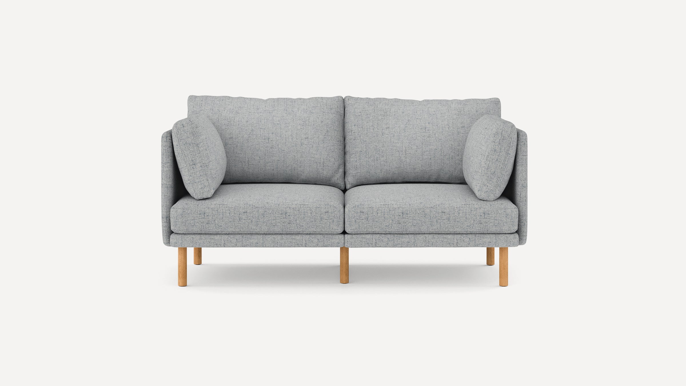Modern light gray fabric two-seater sofa with wooden legs and two side cushions, minimalist design.