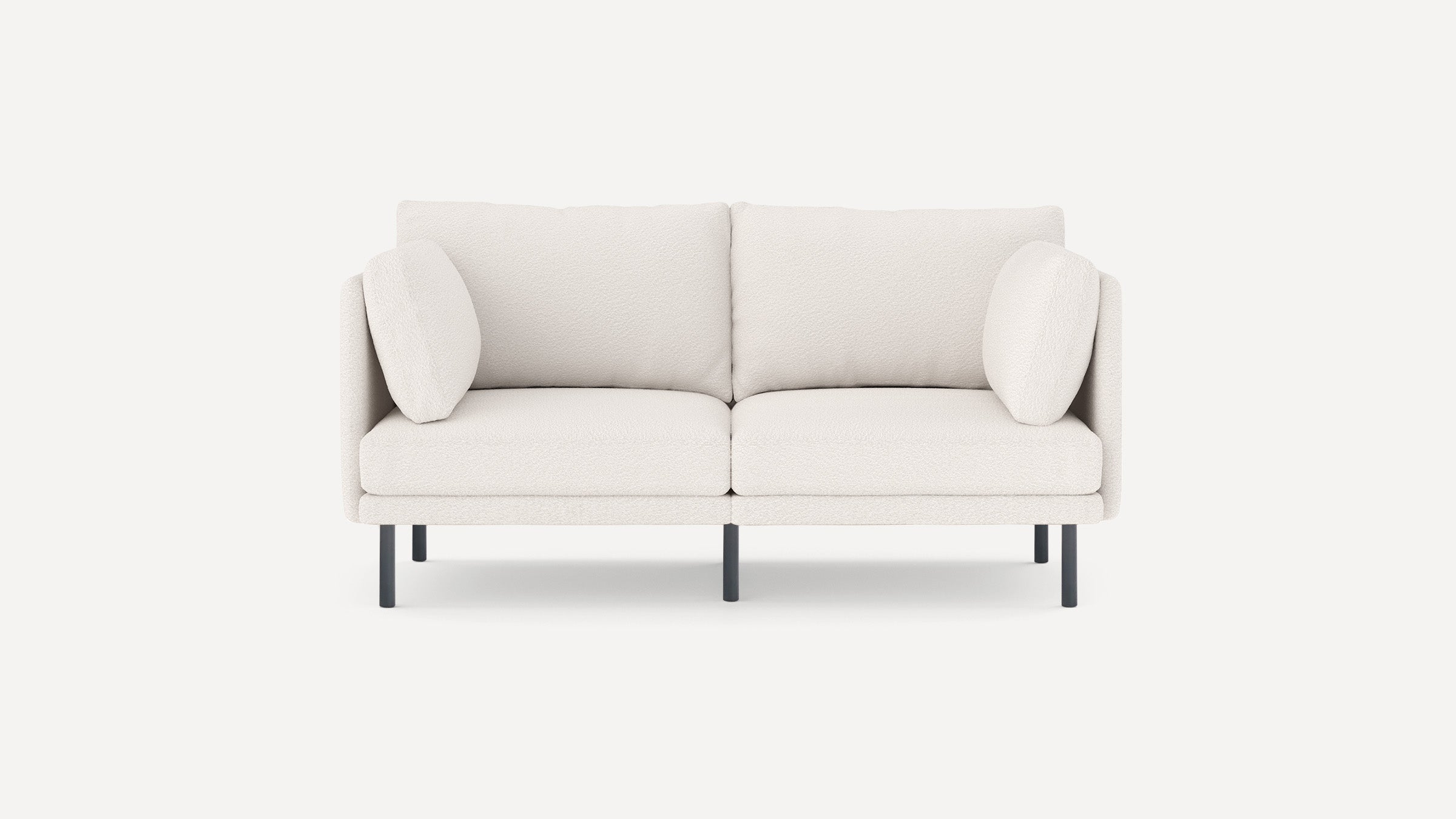 Modern white two-seater sofa with plush cushions, rounded armrests, and black metal legs, set against a plain background.