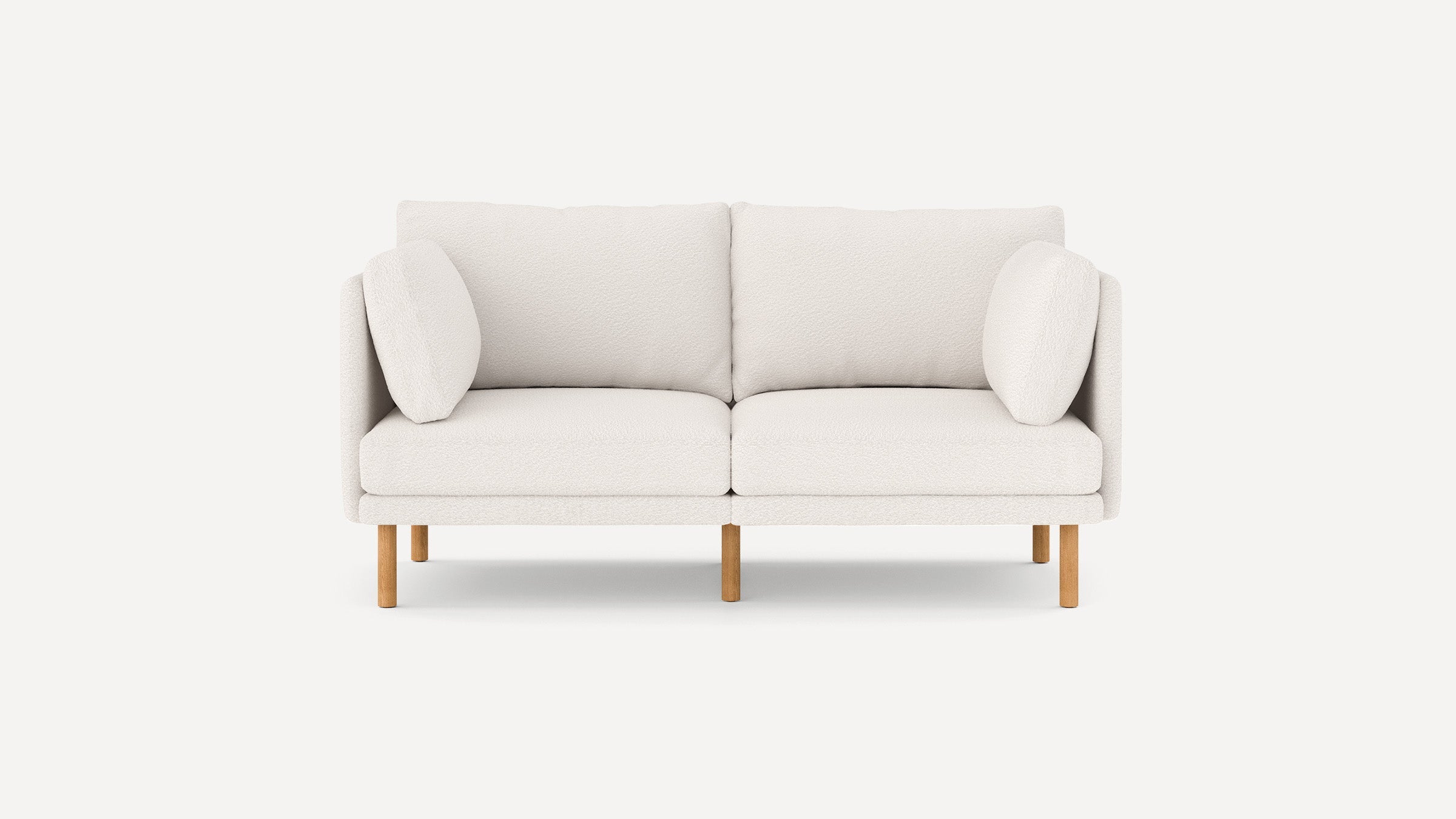 modern light beige fabric loveseat with wooden legs and clean lines on the back, featuring a clean, minimalist design
