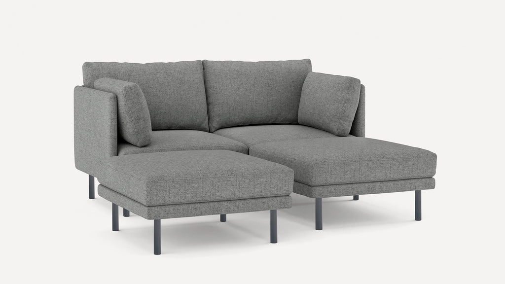 Modern gray fabric sectional sofa with clean lines, metal legs, and plush cushions, featuring a chaise lounge on the right side.