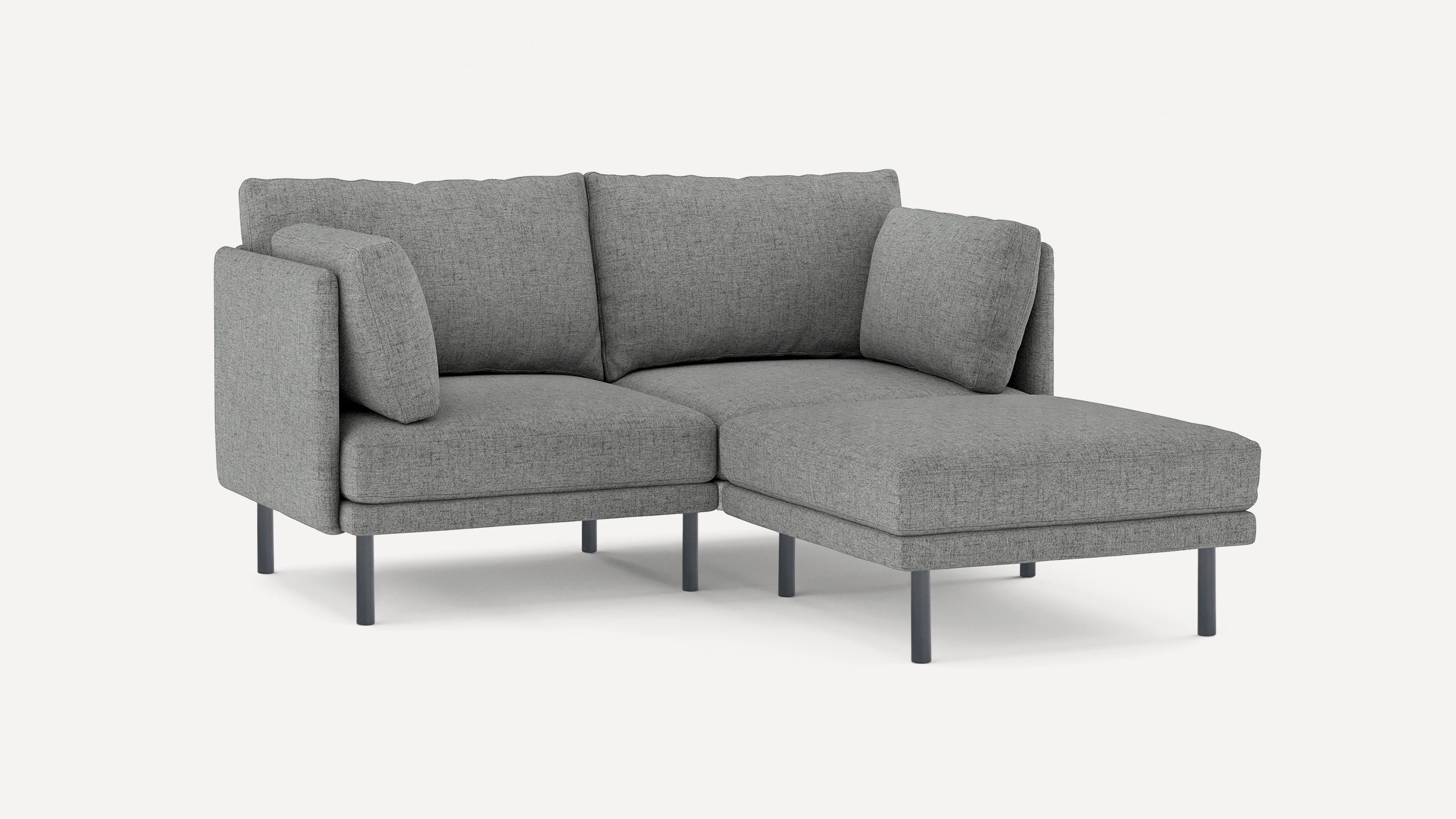 modern gray fabric sectional sofa with chaise lounge and matching ottoman, featuring black metal legs, on a white background