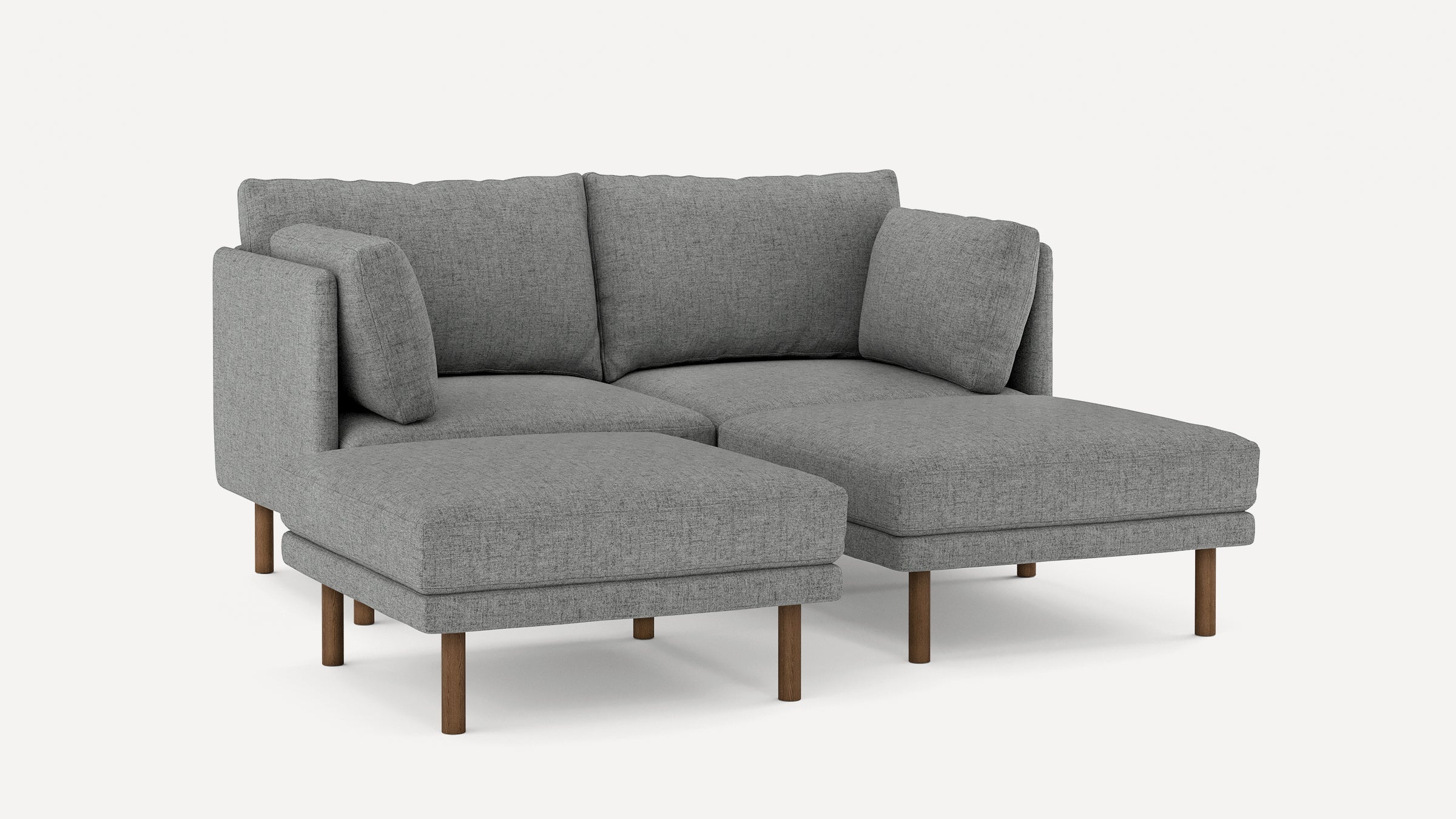Modern gray fabric sectional sofa with clean lines, wooden legs, and plush cushions, designed for comfort and style.