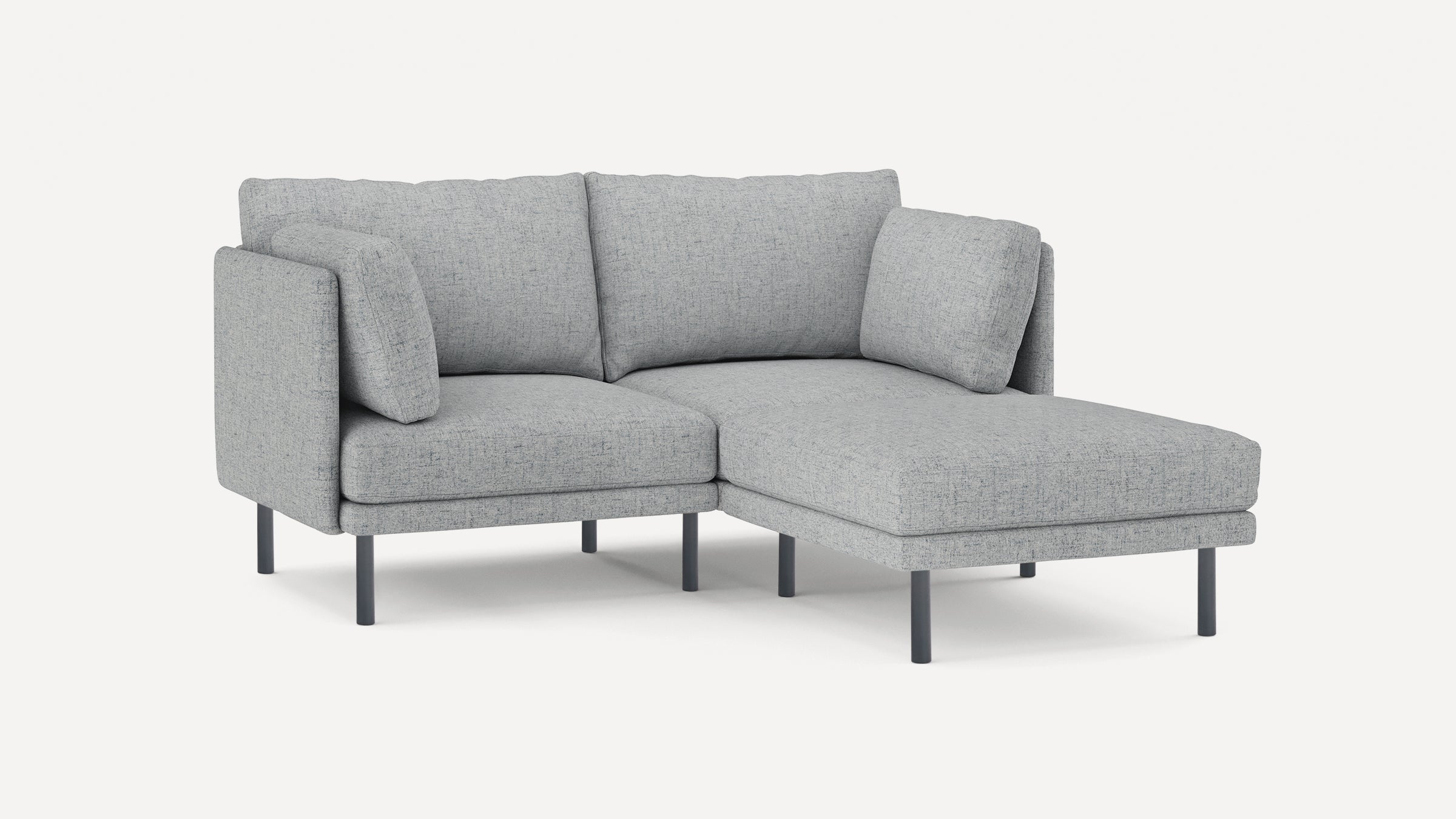 Light gray modern L-shaped sofa with metal legs, cushioned seats, and backrests, designed for comfortable seating.