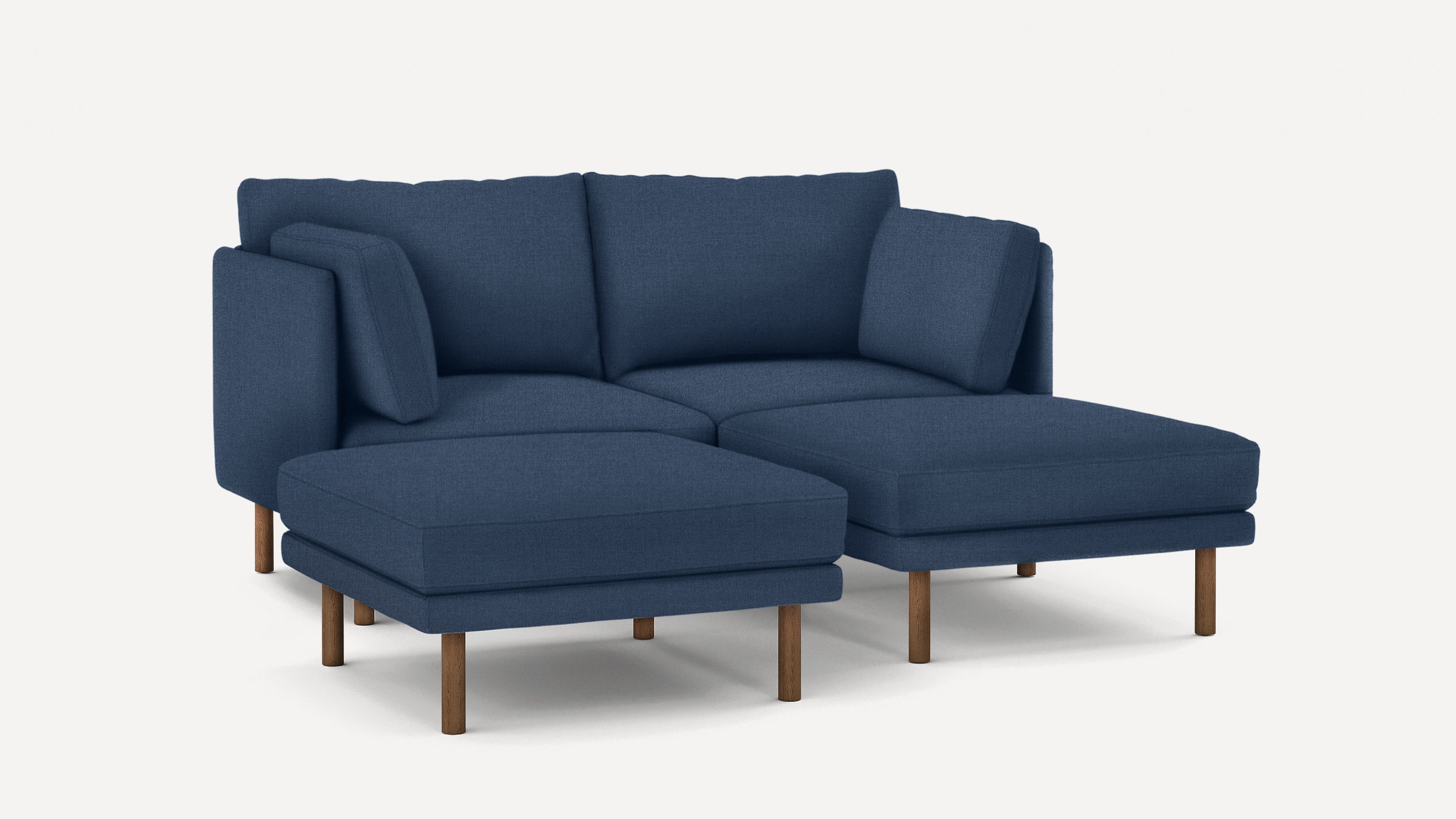 Modern navy blue sectional sofa with wooden legs, featuring cushioned seats and backrests, ideal for cozy living spaces.