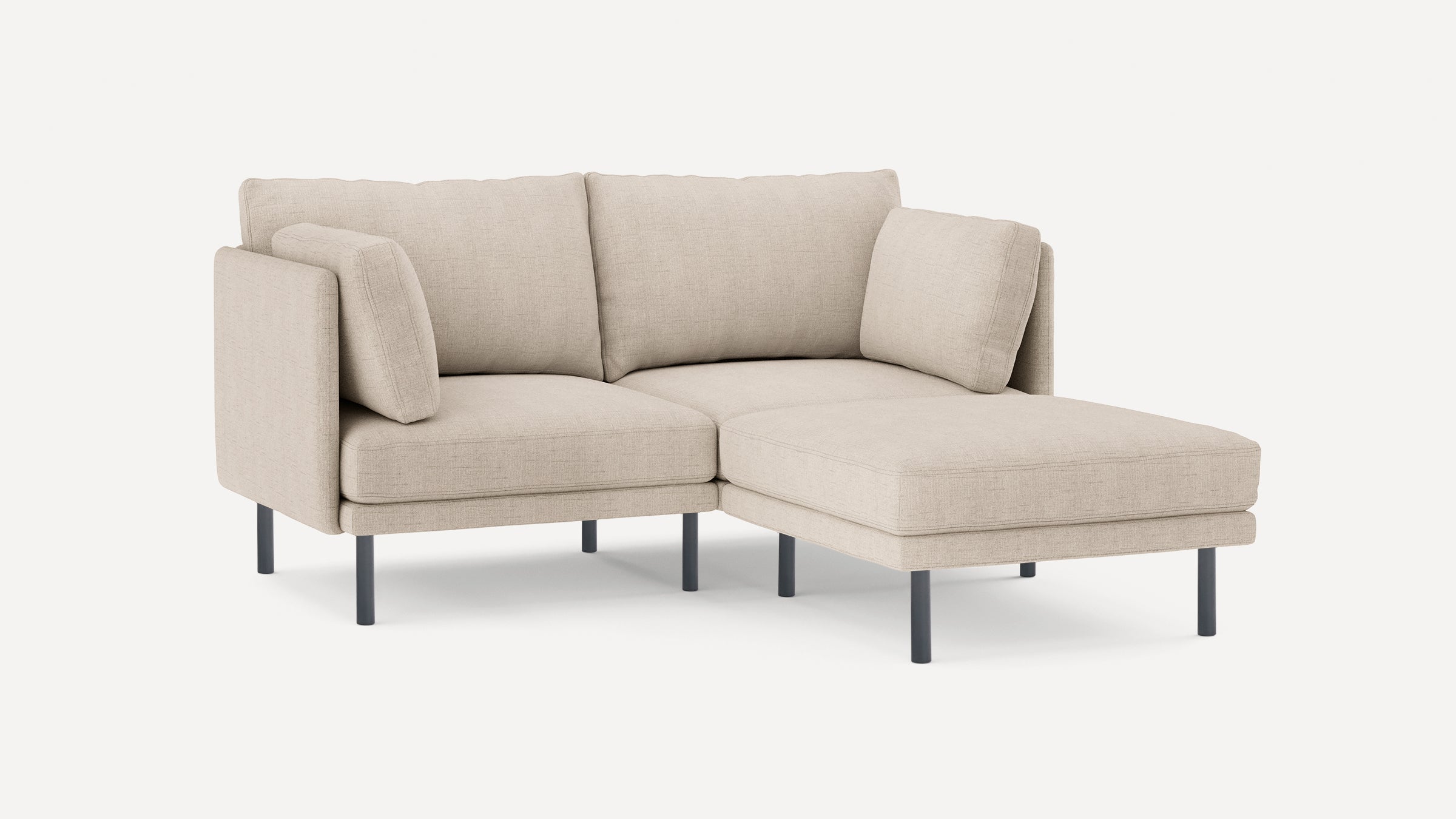 modern beige fabric sectional sofa with chaise lounge and black metal legs, featuring clean lines and clean lines on the back