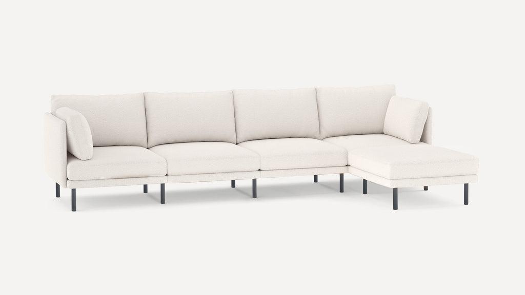 Modern white sectional sofa with textured fabric, clean lines, metal legs, and included cushions for added comfort.