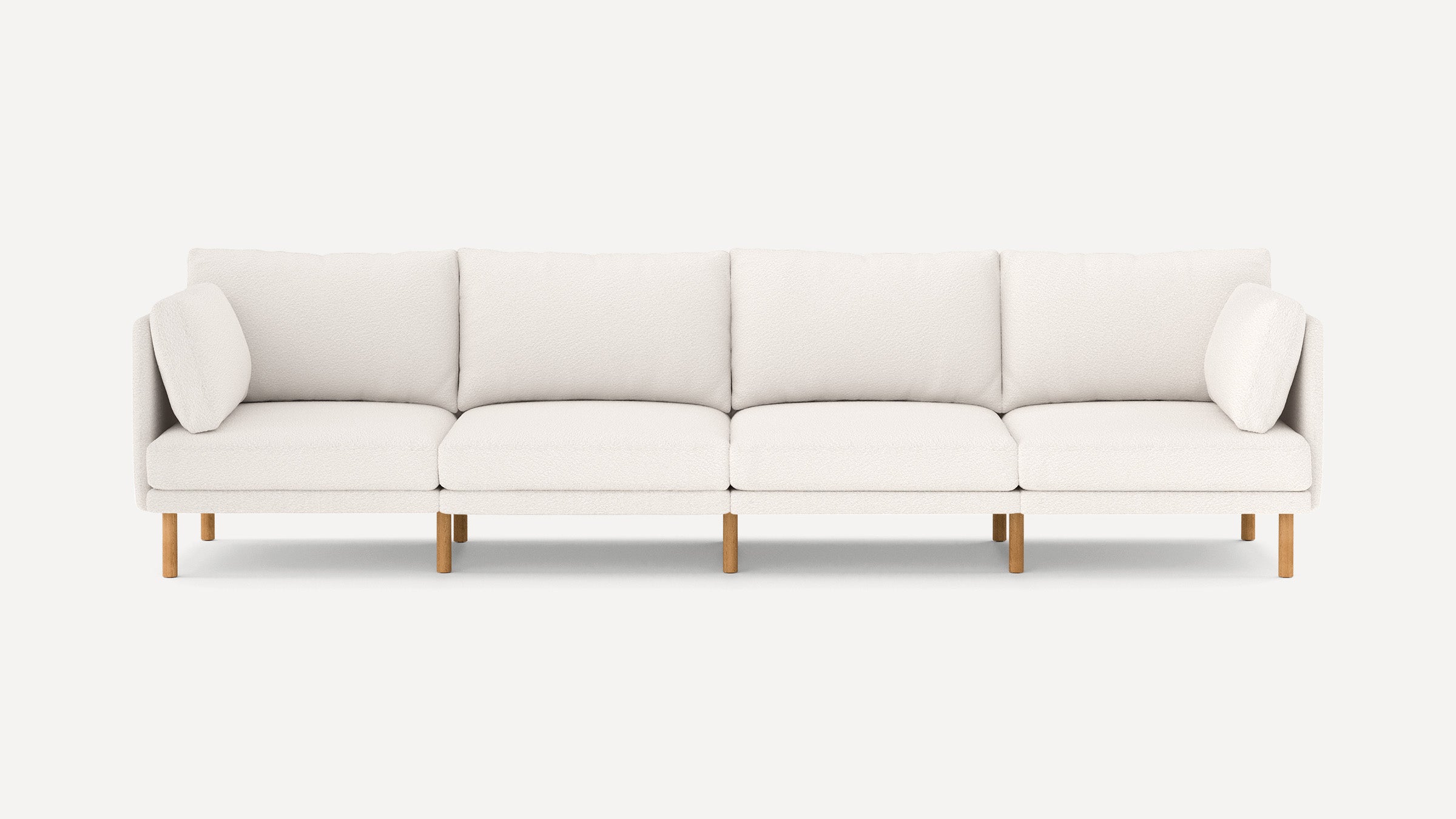 modern light beige fabric sectional sofa with wooden legs and clean lines on the back, featuring clean lines and clean lines on the front