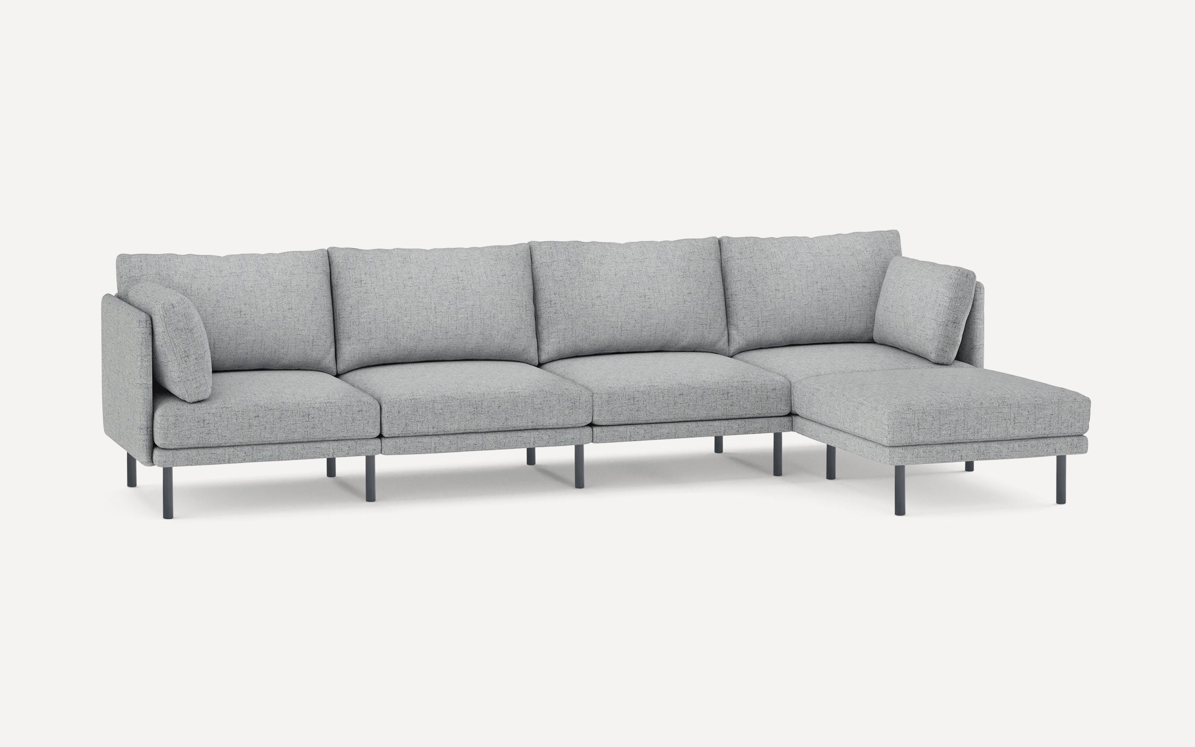 Modern light gray fabric sectional sofa with multiple cushions and black metal legs, designed for spacious seating comfort.