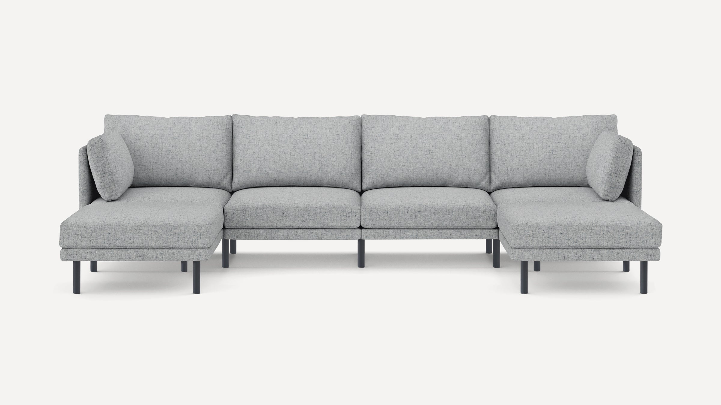 Light grey fabric sectional sofa with modern design, featuring clean lines, low back cushions, and black slim legs.