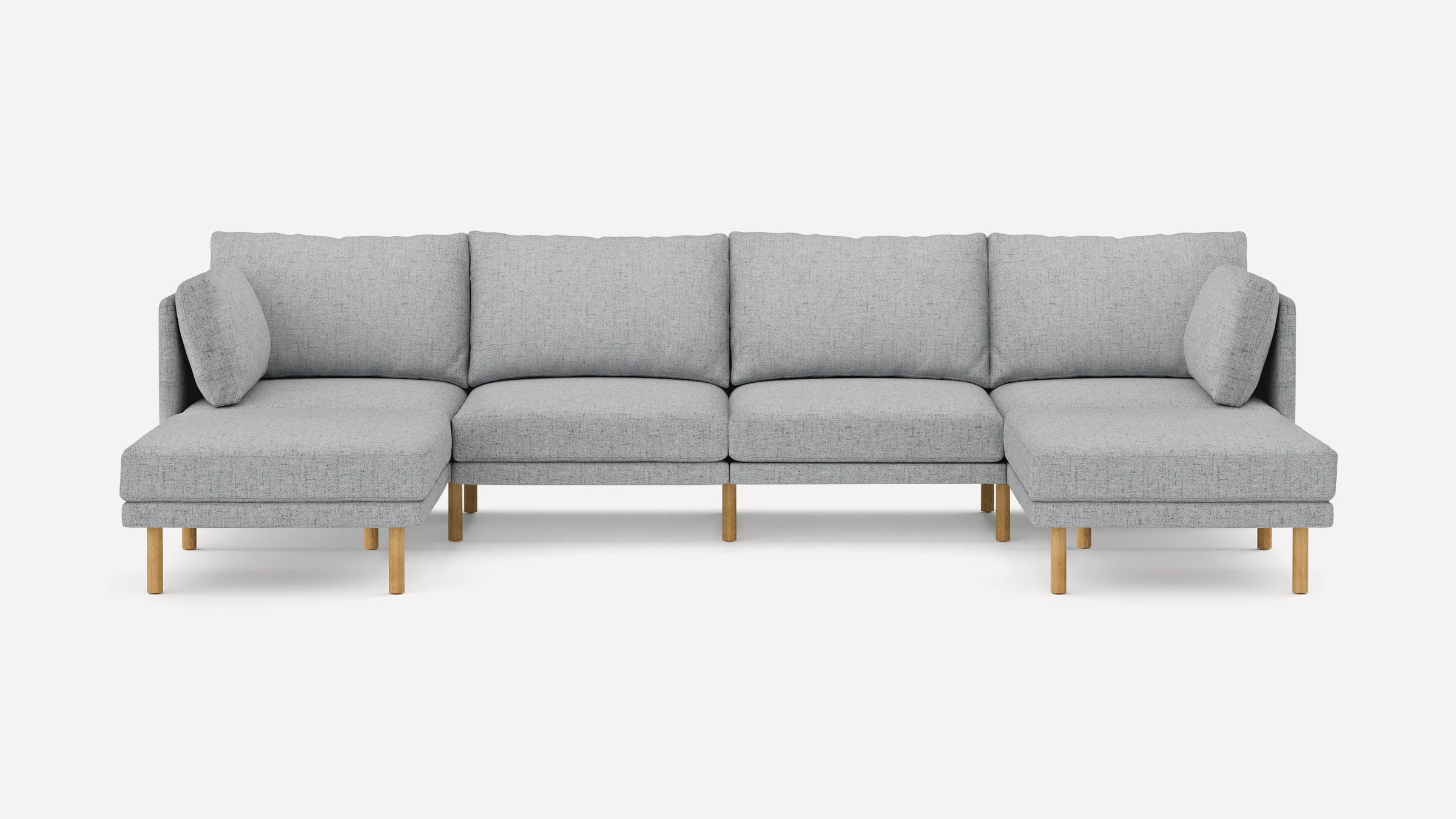 Light gray modern sectional sofa with fabric upholstery, wooden legs, and multiple cushions, featuring chaise lounges on both ends.