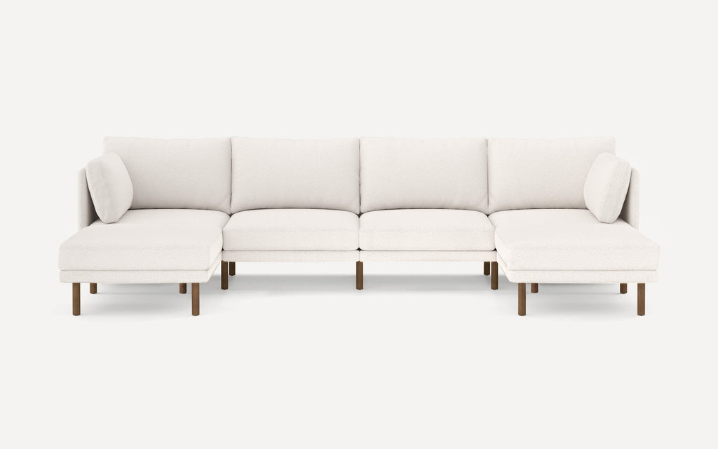 Modern white upholstered sectional sofa with wooden legs, featuring a left and right chaise lounge and removable cushions.