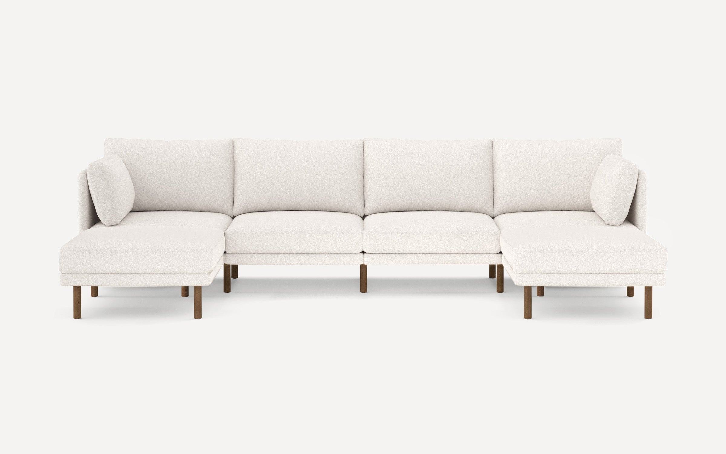Modern white upholstered sectional sofa with wooden legs, featuring a left and right chaise lounge and removable cushions.
