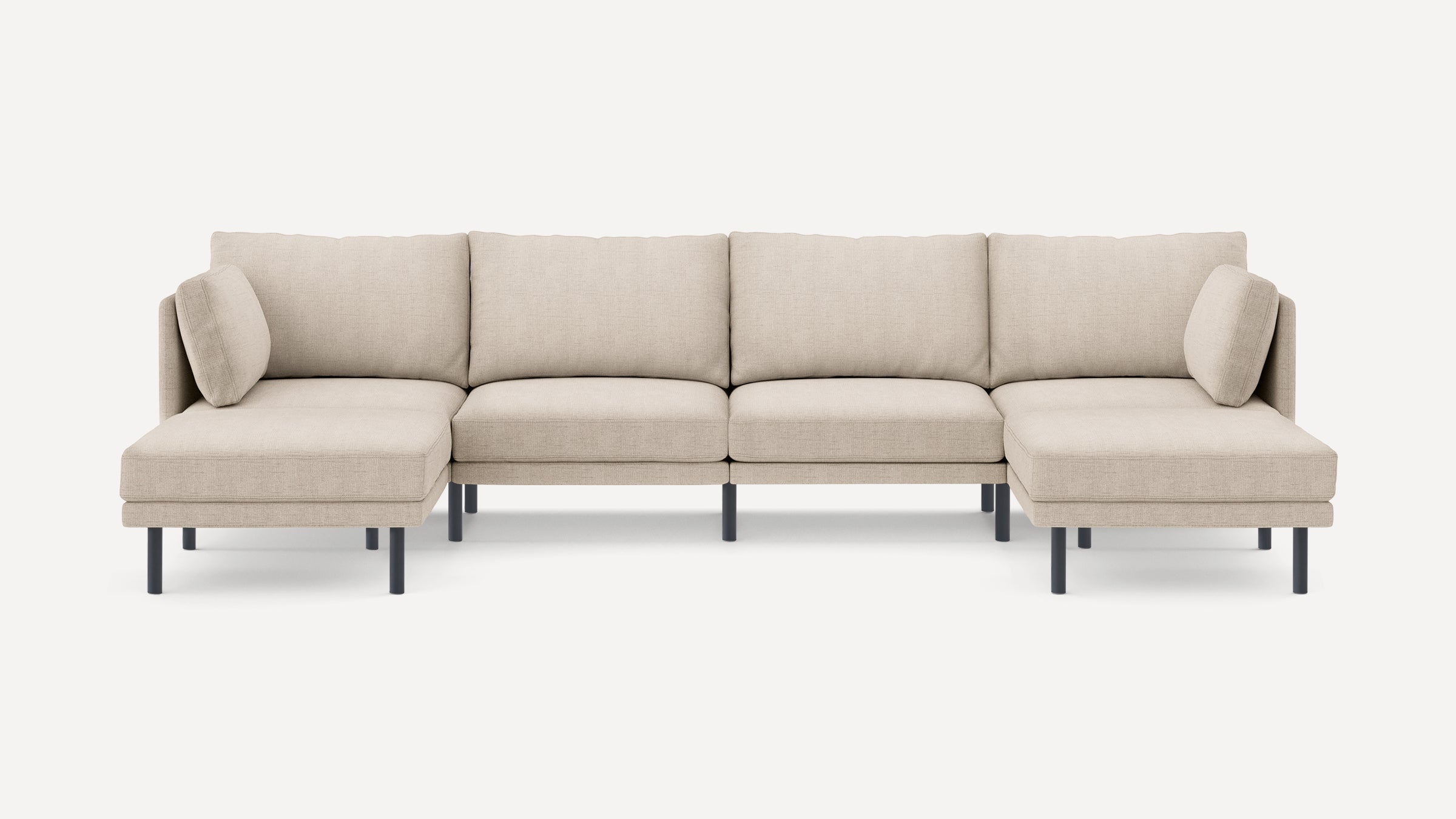 Modern beige sectional sofa with clean lines, metal legs, and cushioned back and seat for comfortable seating.