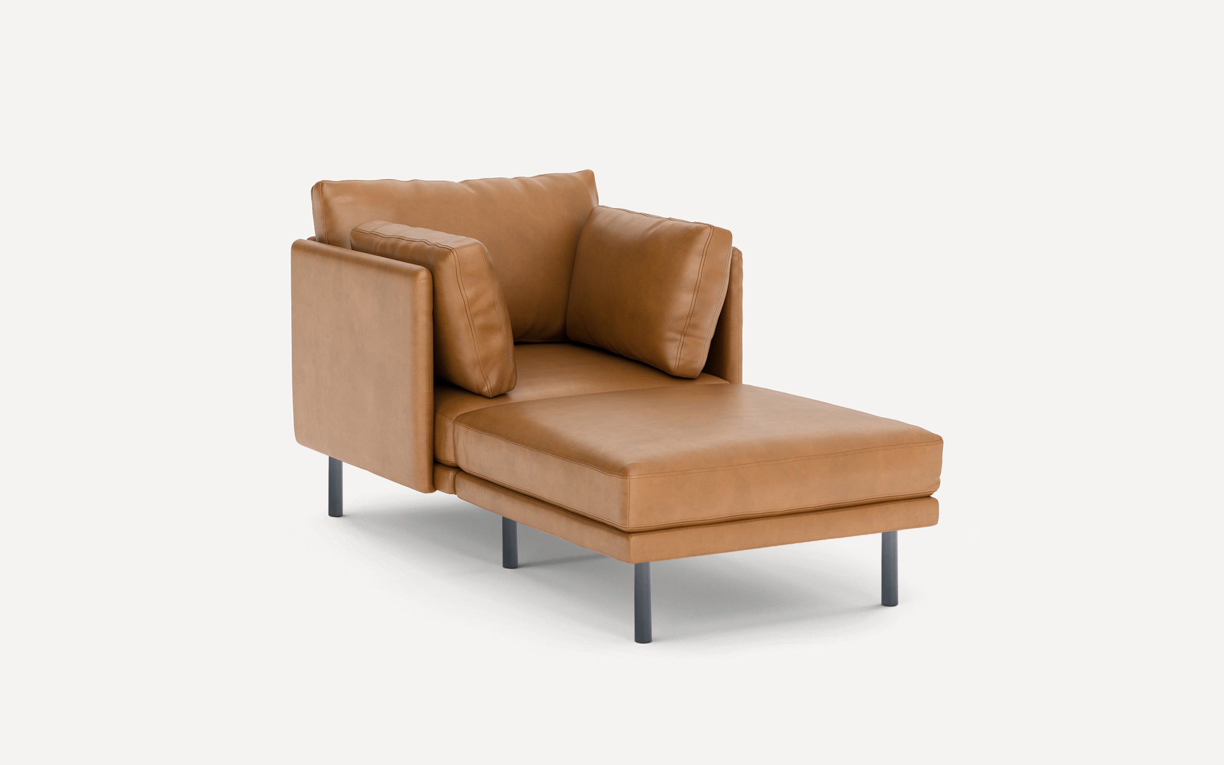 Modern tan leather chaise lounge with metal legs, thick cushions, and angled backrest for comfortable seating.