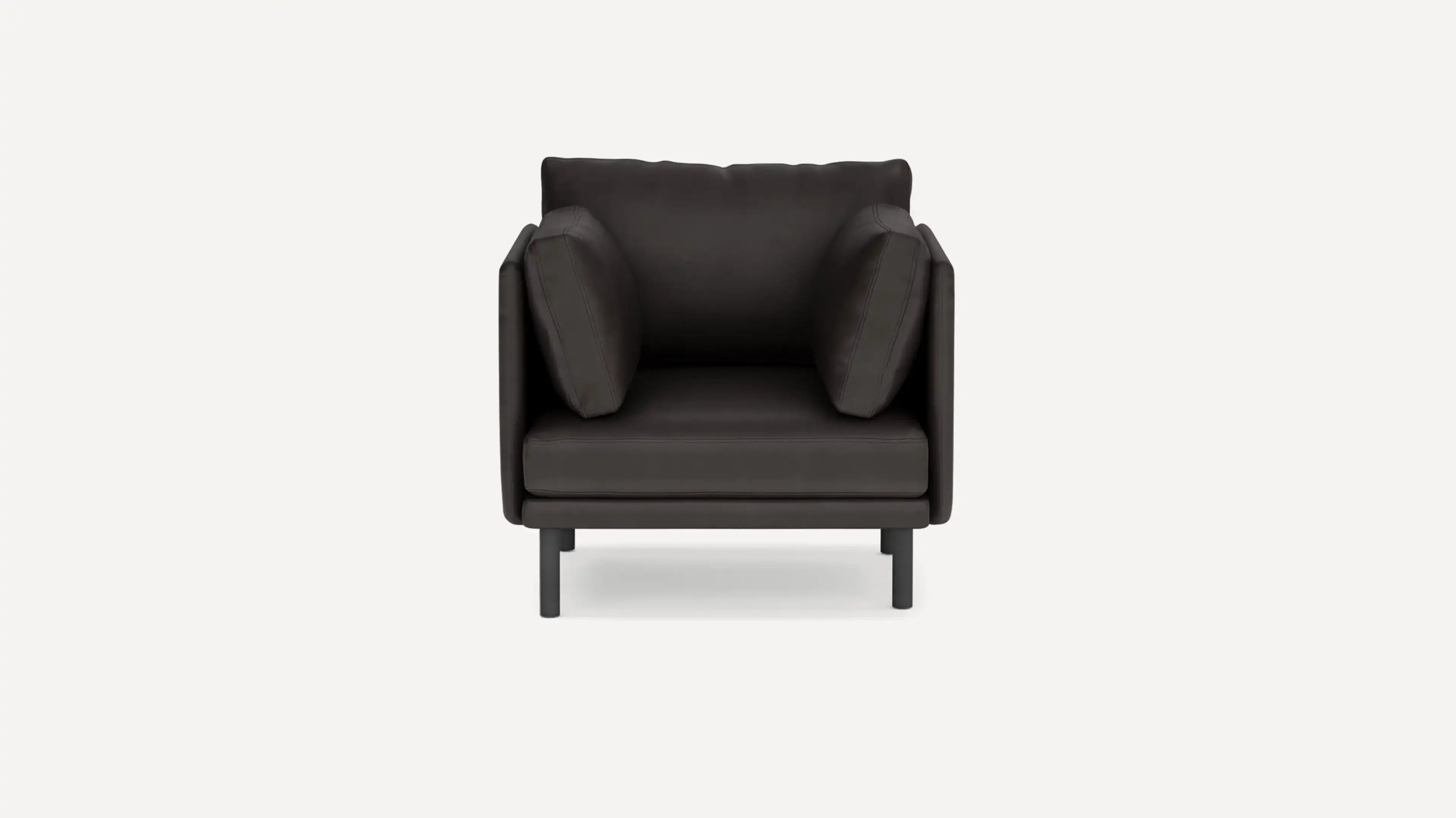 modern black leather armchair with black metal legs and a soft cushion on the backrest
