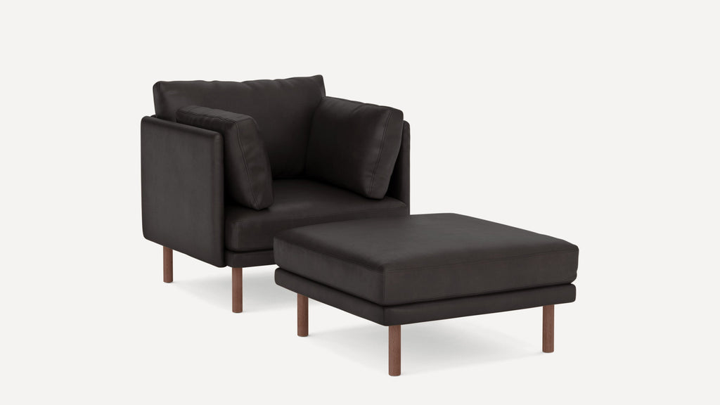 Modern dark brown leather armchair with matching cushioned ottoman, both supported by wooden legs.
